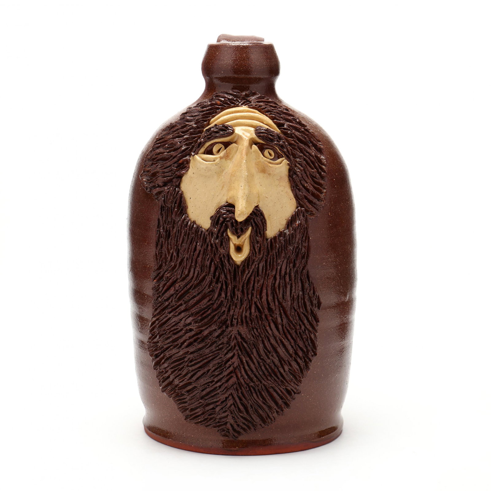 NC Folk Pottery, Billy Ray Hussey, The Whistler Face: NC Folk Pottery, Billy Ray Hussey, The Whistler Face Jug Lamp Base 1980s, earthenware with brown glaze, frontal decoration of a yellow-slip glazed face of a bearded gent with pursed lips, hollow inter