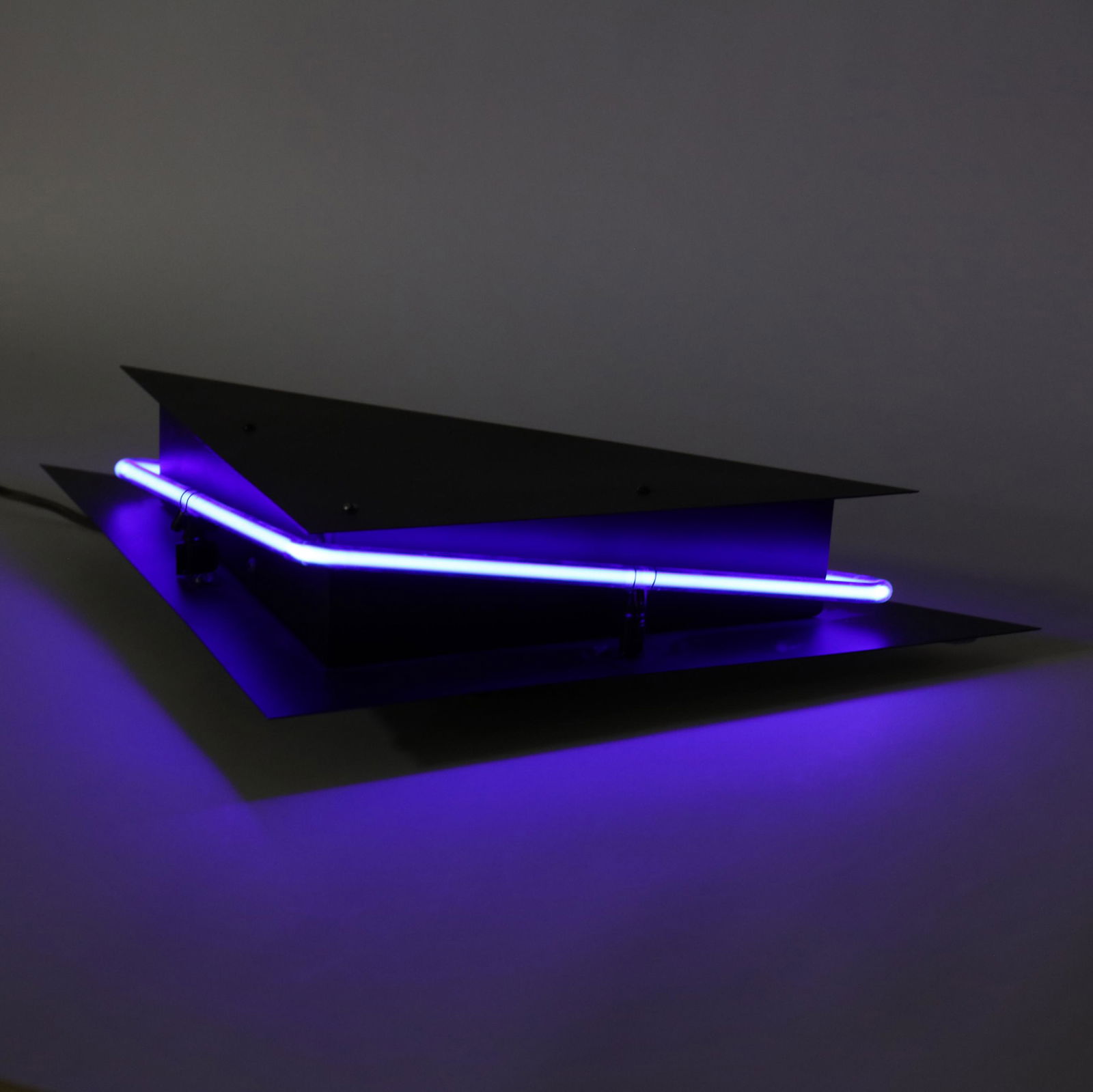 George Kovac, Memphis Neon Wall Light: George Kovac, Memphis Neon Wall Light1980s, black painted steel with neon light surround and interior up-light, unmarked. 11 x 22 in. Additional high-resolution photos are available at www.lelandlitt