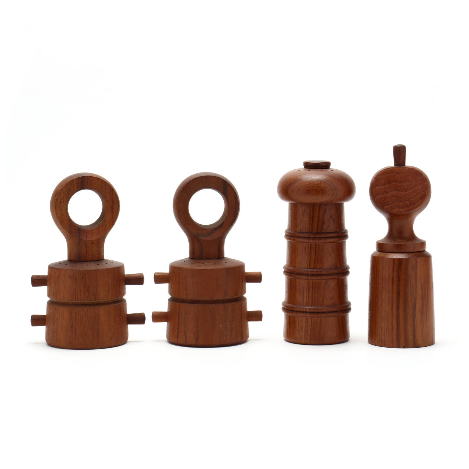 Jens Quistgaard, Four Teak Pepper Mills: Jens Quistgaard, Four Teak Pepper MillsDansk, each in teak, marked. Tallest 8 in. From the Collection of Edward and Della Hudson, Chapel Hill, North Carolina Additional high-resolution photos are avai