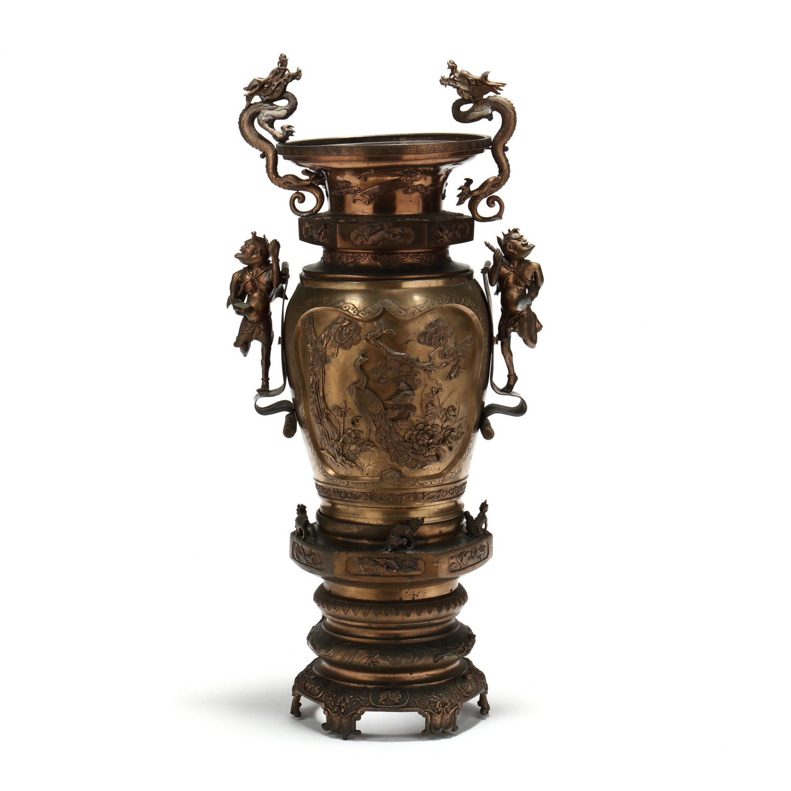 A Large Meiji Period Japanese Bronze Figural Floor Urn: A Large Meiji Period Japanese Bronze Figural Floor Urn circa 1900, three-part form, upper rim with Greek key design and applied dragon-form handles, above a hexagonal cuff with relief dragons, center 