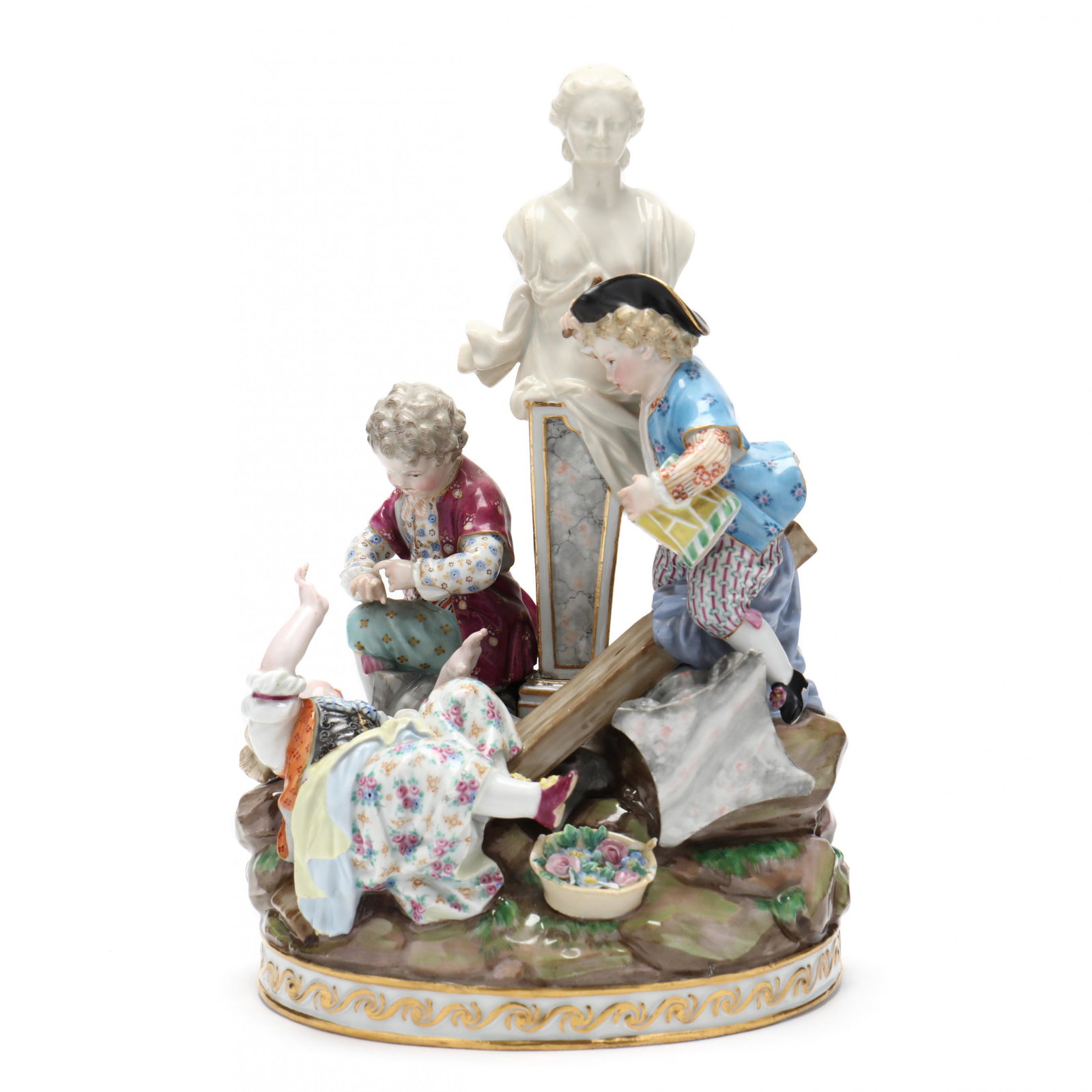 A Meissen Figural Group: A Meissen Figural Group Circa 1880, comprising three frolicking children amongst classical ruins around a smiling herm, raised on an oval gilt-relief decorated base, underside with incised marks (G32)