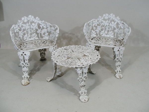 Group of Six Pieces Cast Iron Garden Furniture,: Group of Six Pieces Cast Iron Garden Furniture, including: 3 settees, 2 chairs, and 1 circular table, all w/leaf and vine motif, white paint, "Atlanta Stone Works Atlanta Georgia" marked on 1 settee,