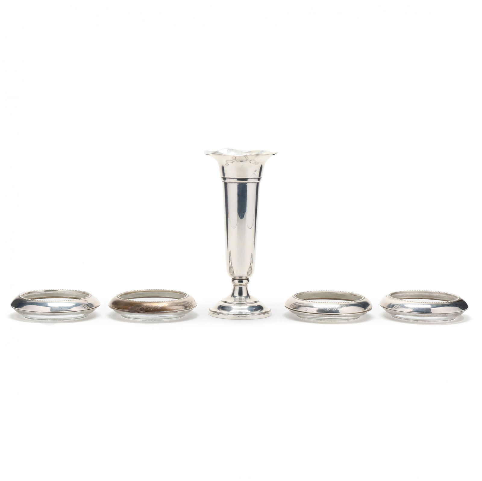 Five Sterling Silver Table Accessories: Five Sterling Silver Table Accessories to include: four glass Coasters by Frank M. Whiting & Co., model number 04, two monogrammed "B.G.P" to molded edge (3.75 in.) ; a flower vase by Preisner Silver