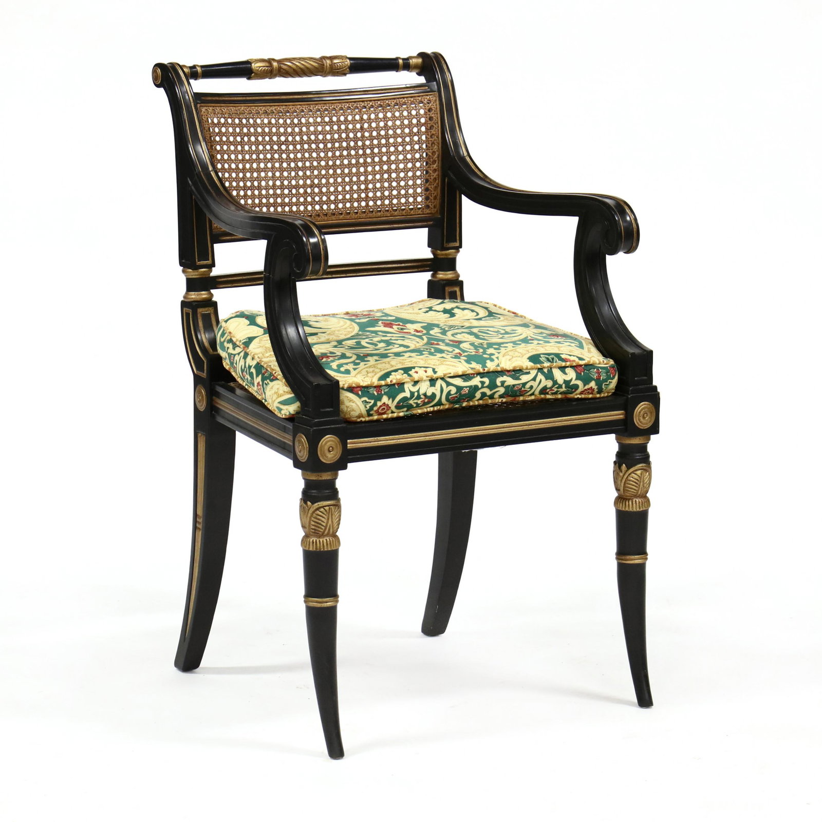 Baker, Regency Style Painted and Cane Seat Arm Chair: Baker, Regency Style Painted and Cane Seat Arm Chair late 20th century, carved and black painted frame with gilt highlights, cane back and seat with custom upholstered cushion, labeled. 35 x 21 x 22 i