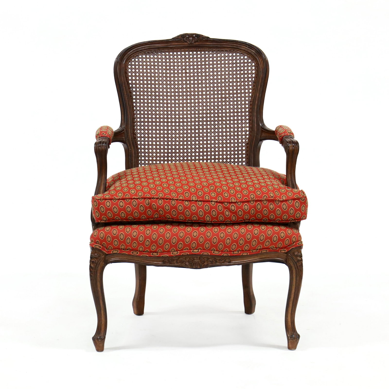 Meyer Gunther Martini, Louis XV Style Carved Cane Back: Meyer Gunther Martini, Louis XV Style Carved Cane Back Fauteuil contemporary, carved and distressed wood frame, cane back, red/gold/black woven upholstery, loose down-filled cushion, labeled. 37 x 26 
