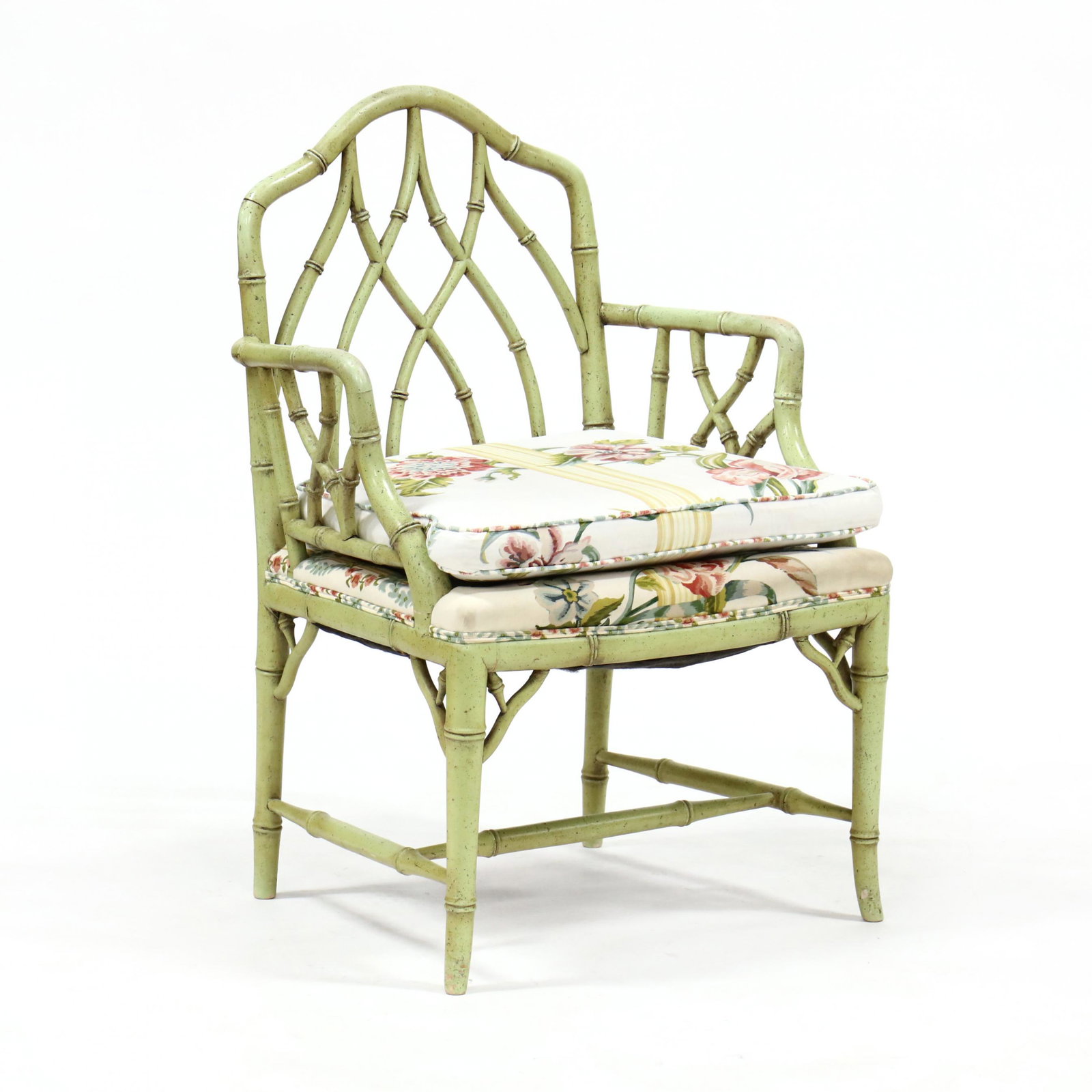Painted Faux Bamboo Arm Chair: Painted Faux Bamboo Arm Chair circa 1980, light green antique painted surface, wood frame in a carved faux bamboo motif, floral upholstered cushion. 37 x 25 x 19 in., seat height 20.5 in. Private Coll