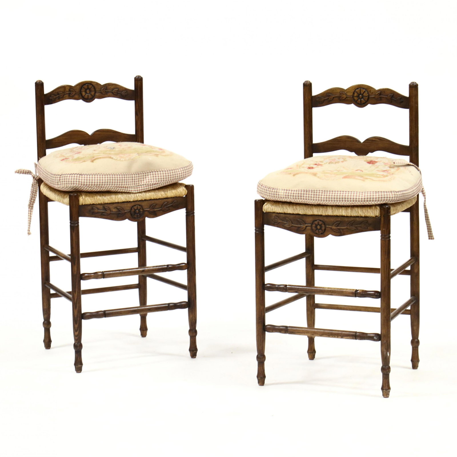 Pair of French Provincial Style Carved Oak Barstools: Pair of French Provincial Style Carved Oak Barstools late 20th century, floral carved ladder back, Aubusson style rooster upholstered down-filled cushions, rush seats, repeating floral carved seat rai