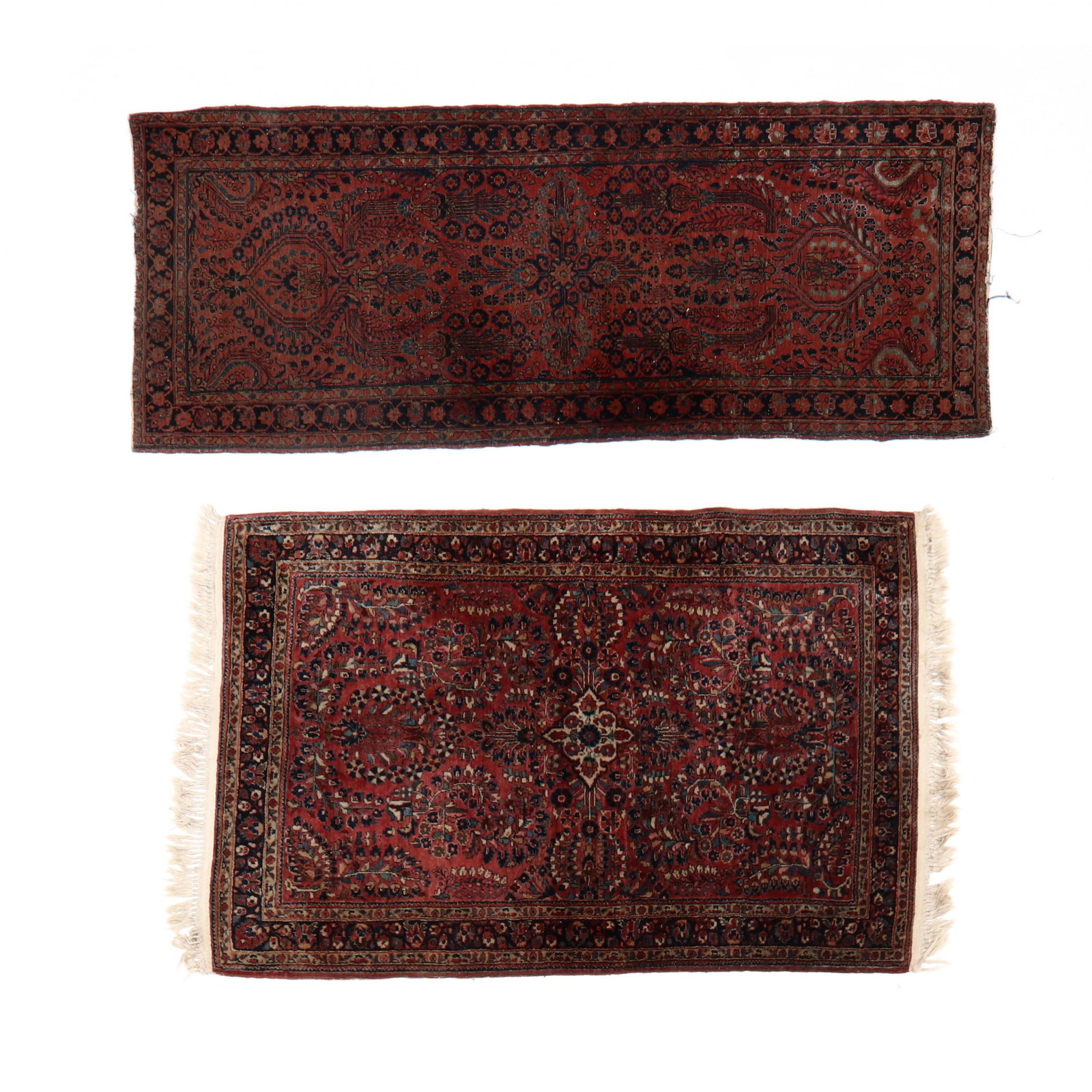 Two Sarouk Area Rugs: Two Sarouk Area Rugs the first wine field with floral design and rosette design elements, with navy blue main border with rosettes (2 ft. 6 in. x 6 ft. 1 in.); the second with wine field with small ce