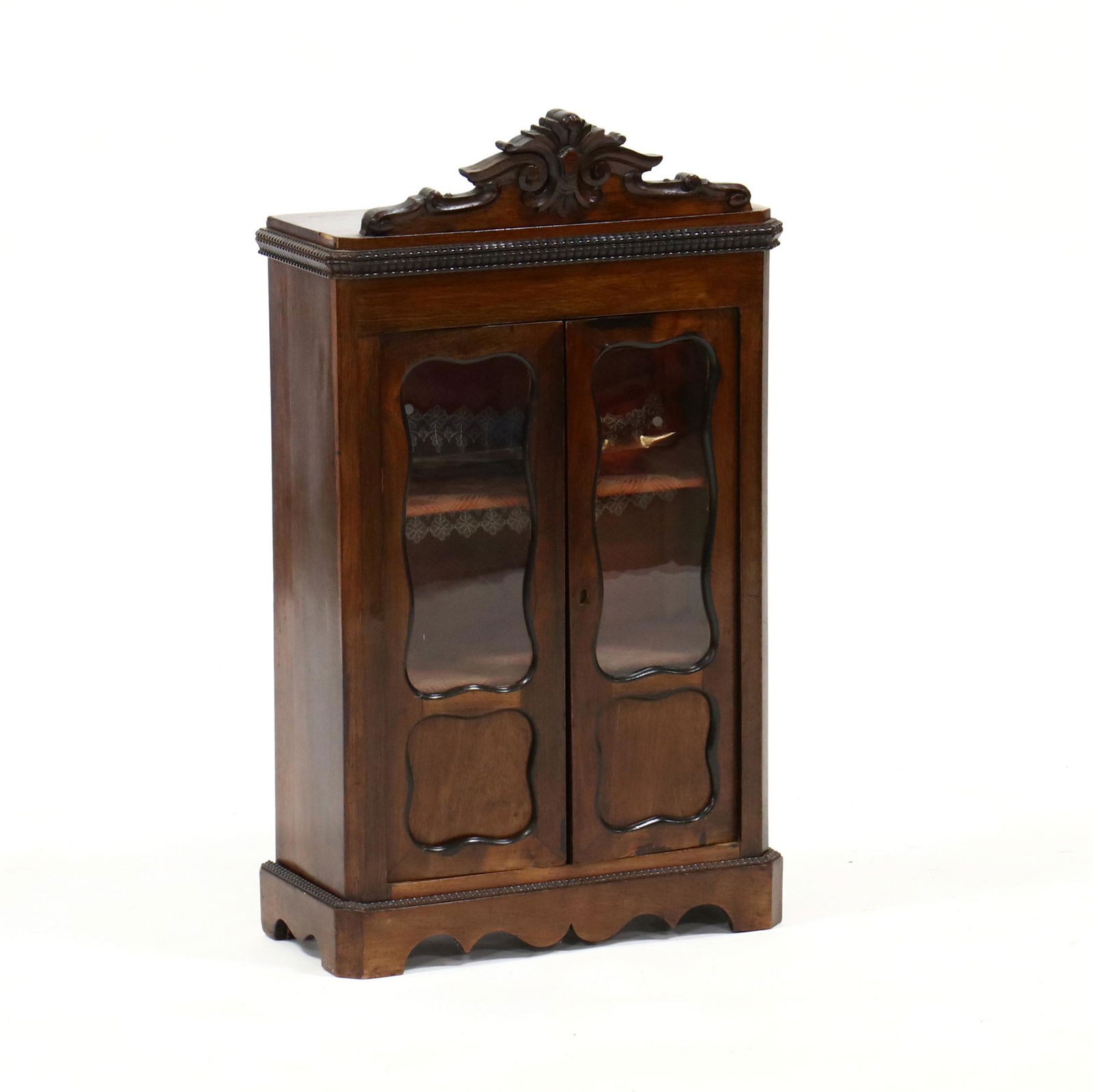 Antique Rococo Style Miniature Display Cabinet: Antique Rococo Style Miniature Display Cabinet19th century, walnut veneer, one-part form with iron rings for wall mounting or can stand alone on the shaped bracket feet, the case with two hinged glaze