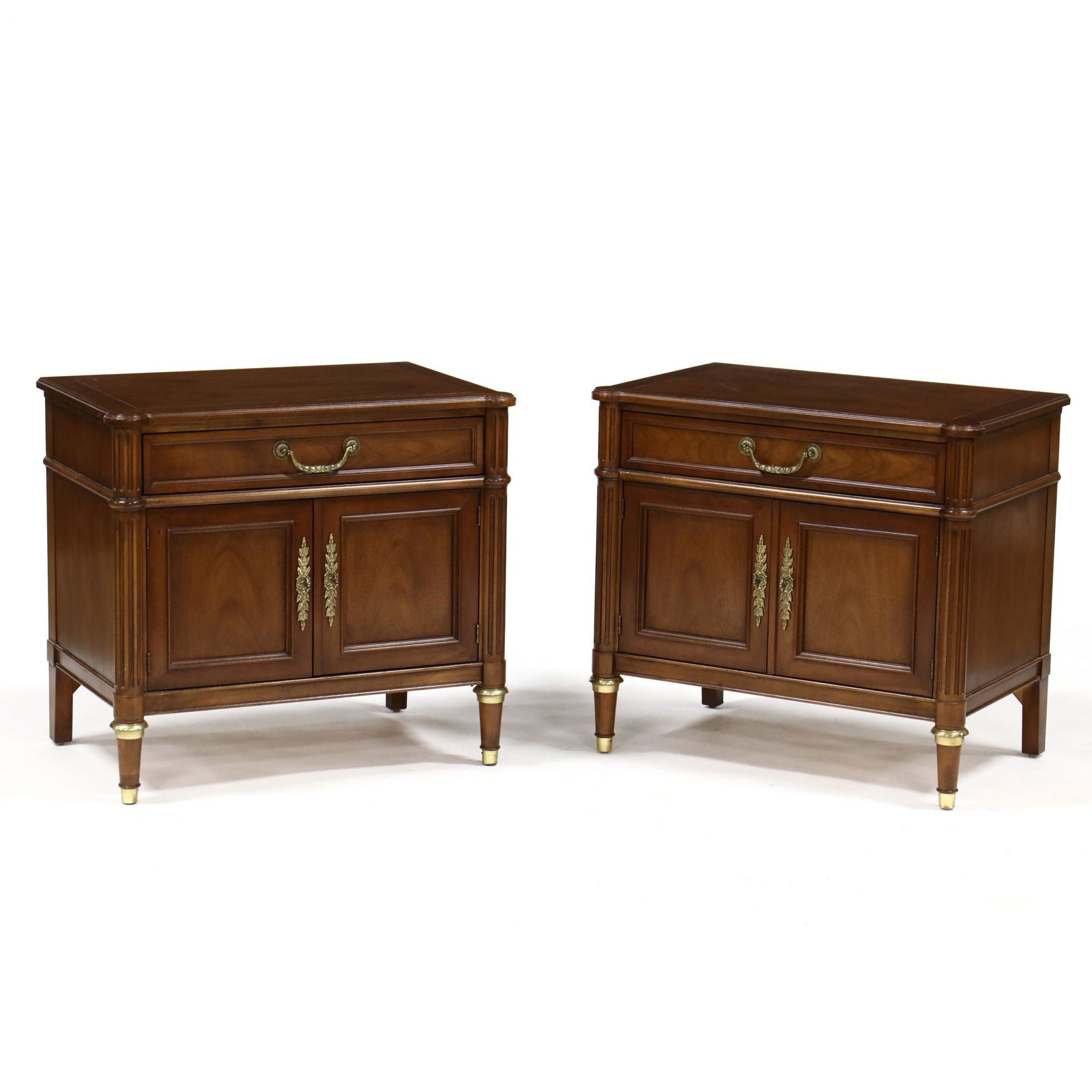 Baker, Pair of Louis XVI Style Walnut Diminutive: Baker, Pair of Louis XVI Style Walnut Diminutive Cabinets late 20th century, top with front rounded corners, single paneled drawer over two hinged paneled cabinet doors with open interior, flanked by 