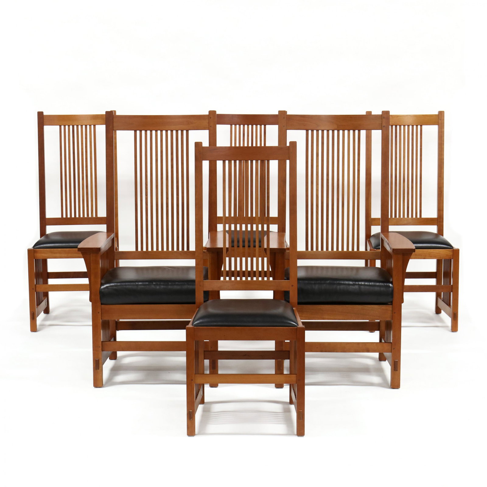 Stickley, Set of Six Mission Cherry Dining Chairs: Stickley, Set of Six Mission Cherry Dining Chairs late 20th century, including two arm chairs and four side chairs, each wtih a tall slat back and arms with black leather seats, through tenon stretche