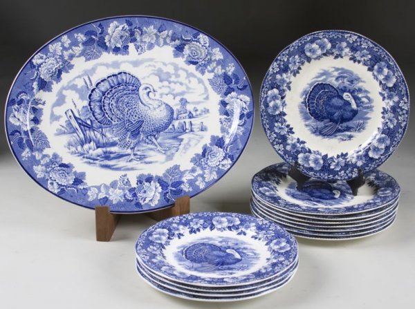 Assembled Set Flow Blue Turkey China, English,: early 20th c., Wood & Sons, Burslem, Flow Blue Turkey platter with floral border, (15" x 18.5)"; (11) Wedgwood & Co., Flow Blue turkey dinner plates with dogwood border, (11" dia.) Two dinner plates w
