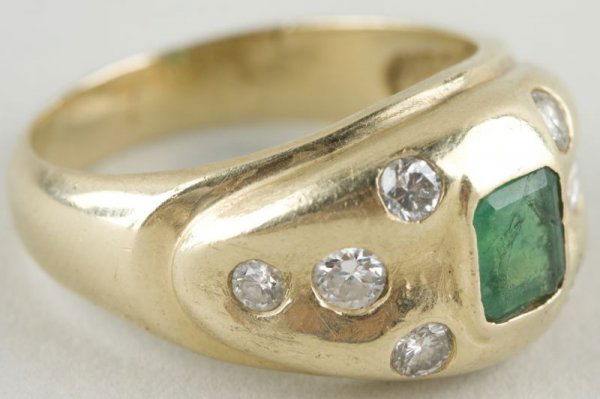 14KT Yellow Gold Emerald & Diamond Ring,: with center rectangular emerald (1 ct.), and (8) round brilliant diamonds (1 ct.) Ring size: 8.5 7.1g. Collection of Larry Fraga, Mocksville, North Carolina