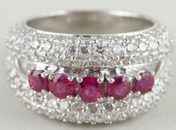 14KT White Gold Ruby & Diamond Ring,: (5) rubies (1ct.) enhanced by three rows of pave diamonds on each side ((122) diamonds total (2.25 ct.)) Ring size: 7.5 11.4g. Collection of Larry Fraga, Mocksville, North Carolina