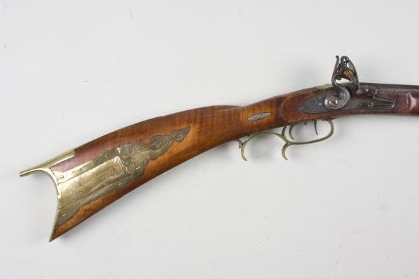 Flintlock Long Rifle,: no makers mark, ca. 1790 - 1820, 39.25" octagonal barrel with 3/8" bore, (LOA 56.5"), maple stock, factory lockplate and hammer, (4) silver inlays, one engraved with American eagle. Expected dings to 