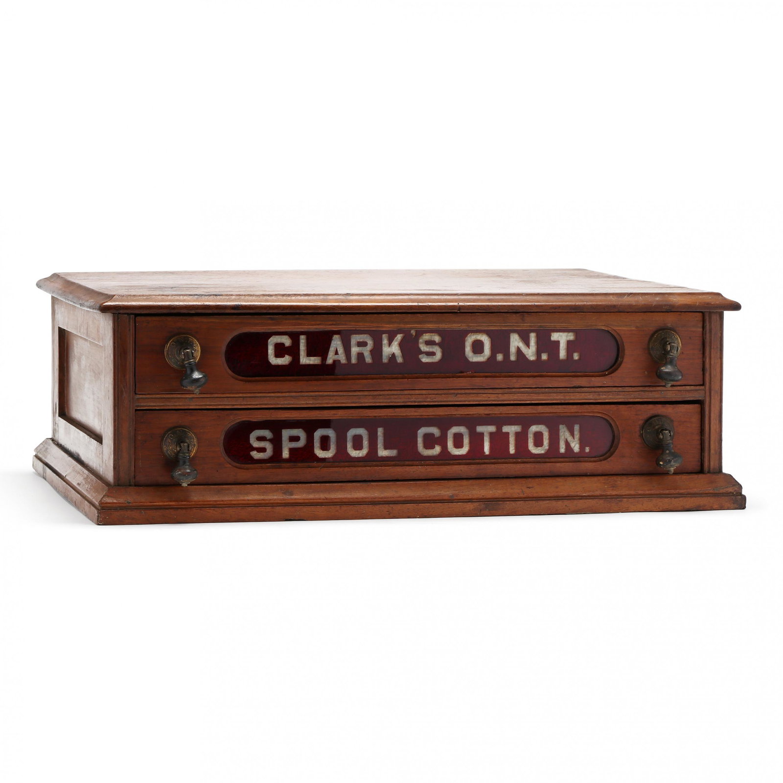 Clark's Two Drawer Walnut Spool Cabinet: Clark's Two Drawer Walnut Spool Cabinetlate 19th century, two drawers with red cut to clear glass panels, original drop pulls, paneled sides, flush base. 7.5 x 22 x 15 in. Additional high-resolution