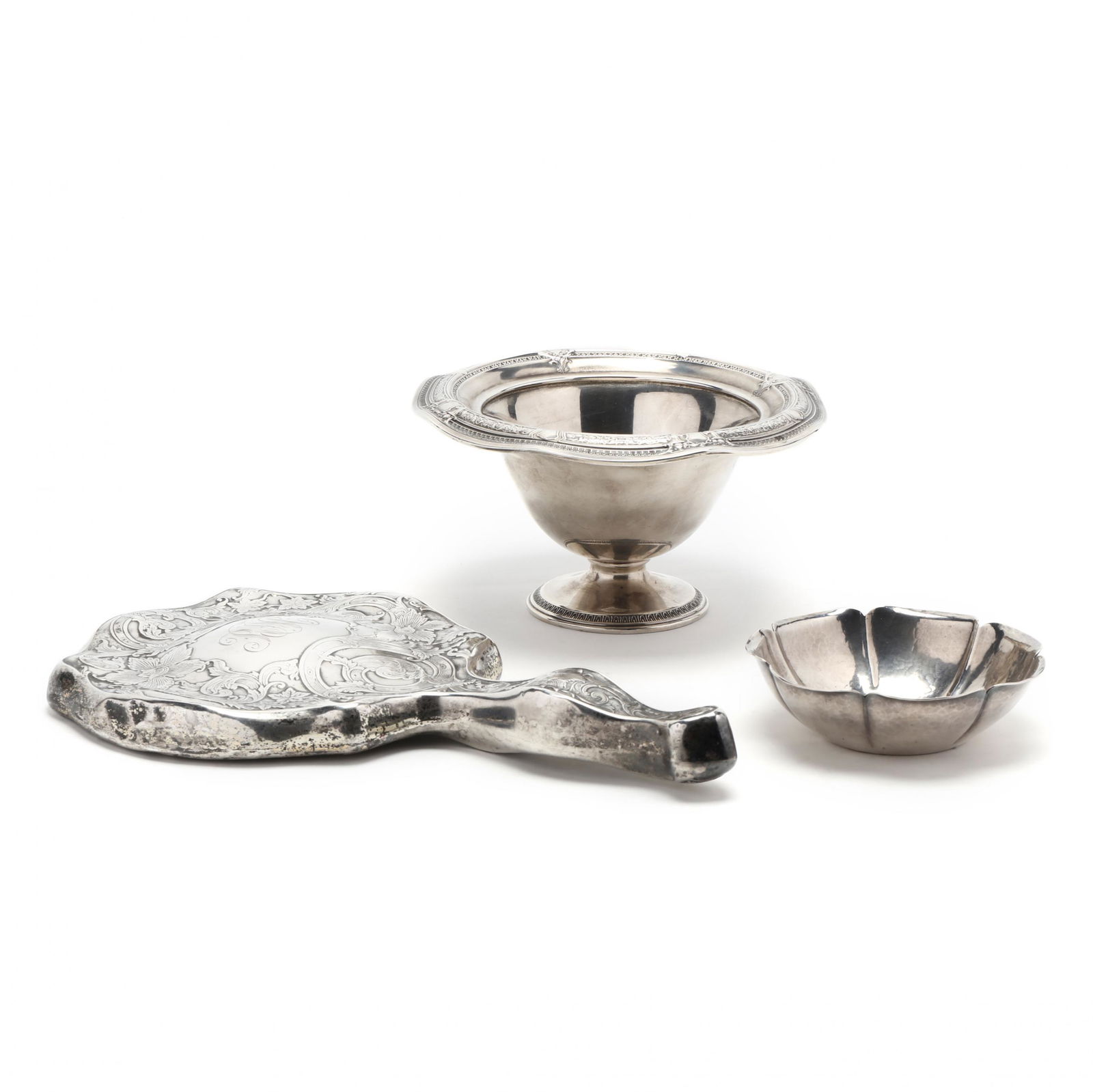 Three Sterling Silver Table Accessories: Three Sterling Silver Table Accessoriesthe first a floral form bowl with hammered finish, mark of Joel F. Hewes (Titusville, Pennsylvania, active circa 1910-1950) to underside (1 x 3 7/8 in.); the sec