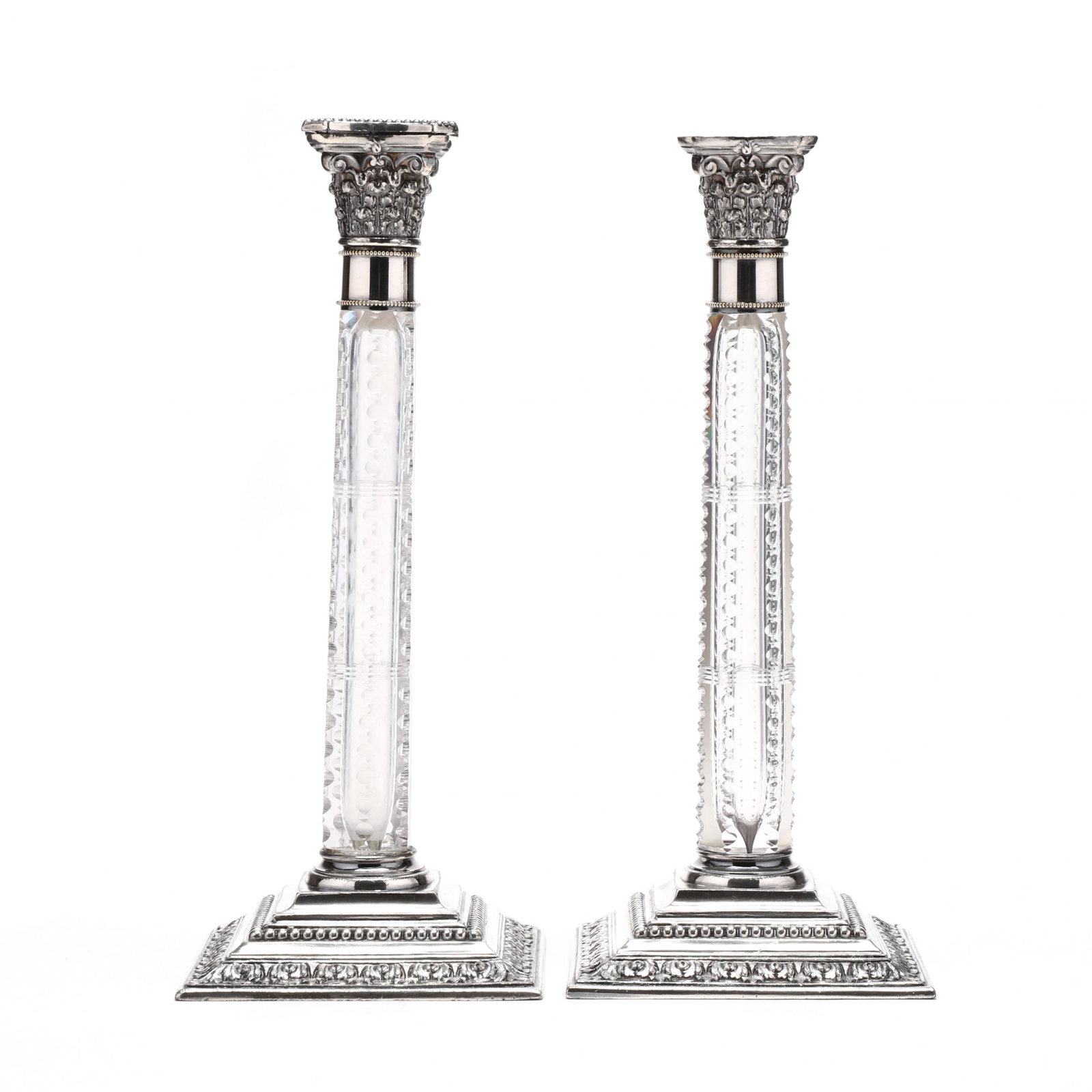 An Unusual Pair of Cut Glass and Silverplate Corinthian: An Unusual Pair of Cut Glass and Silverplate Corinthian Candelsticks late 19th century, mark of Simpson, Hall, Miller & Co., no monograms. 10 1/2 in. Additional high-resolution photos are available at