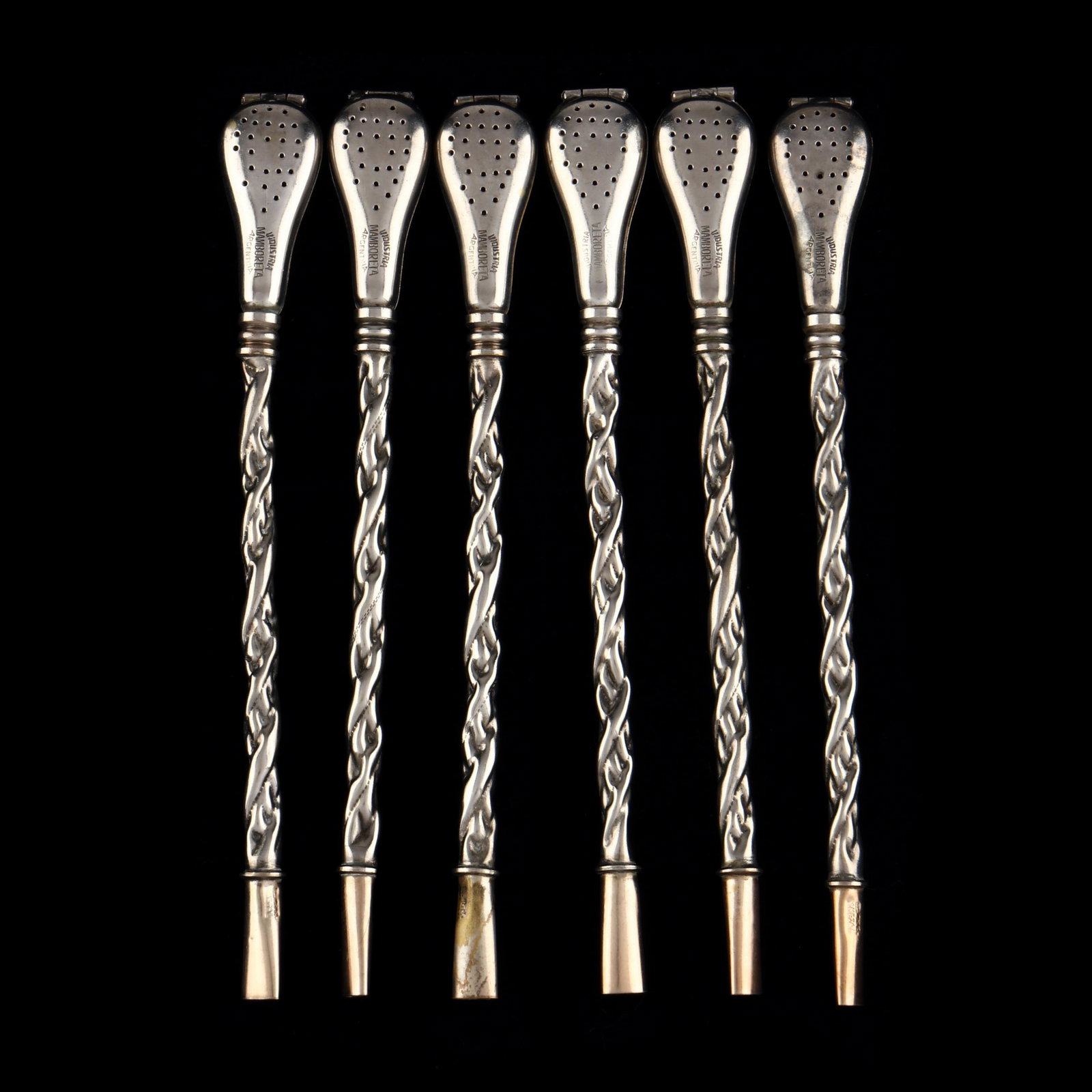 Set of Six Vintage Argentinian Yerba Mate Bombillas: Set of Six Vintage Argentinian Yerba Mate Bombillas mid-20th century, white metal, each marked "Industria / Mamboreta / Argentina," each with gold wash to sipping end, the hinged strainer bowl unscrew