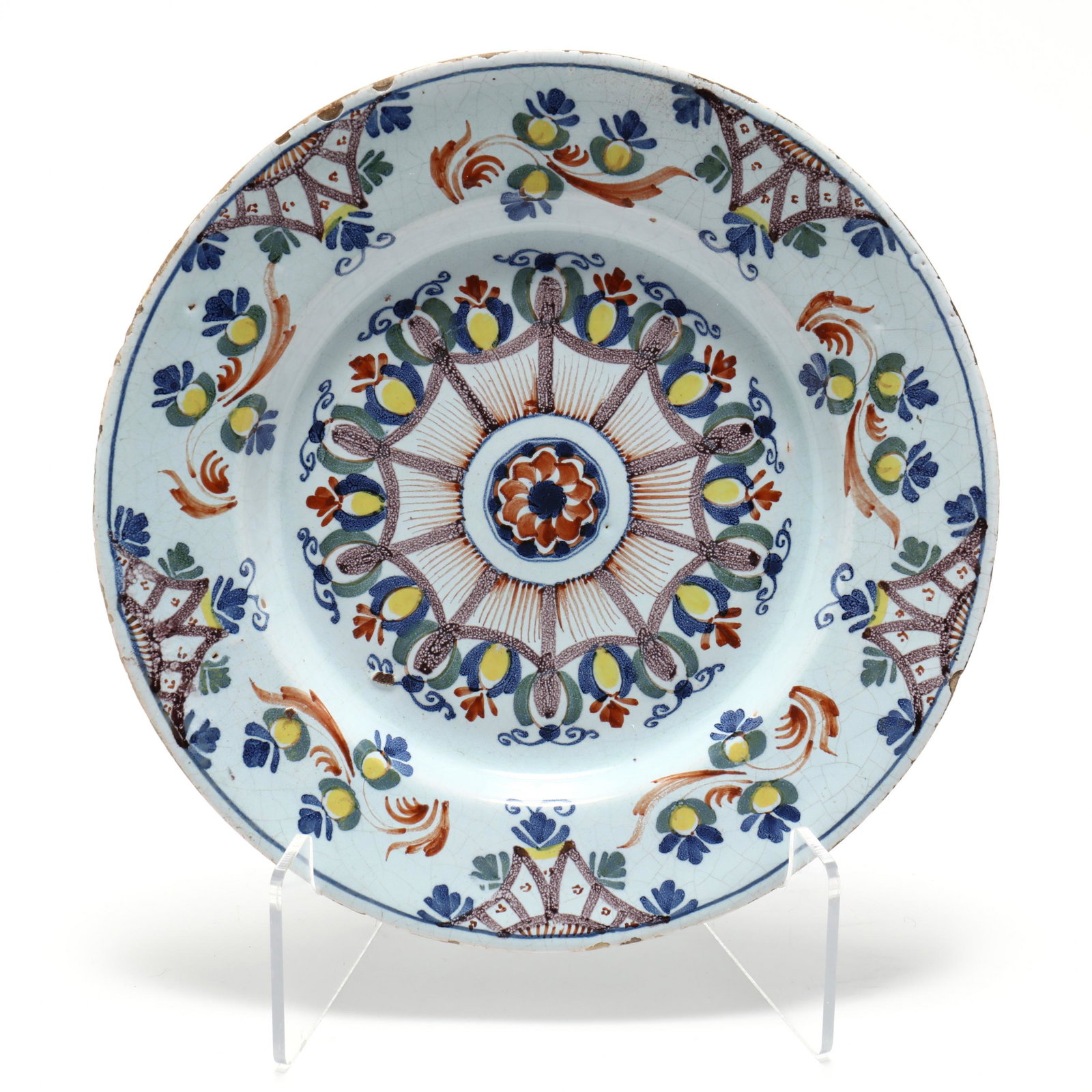 English Delft Charger in the "Anne Gomm" Style: English Delft Charger in the "Anne Gomm" Style circa 1790, Lambeth, of the Ann Gomm pattern painted in polychrome enamels of five colors with a central rosette inside a manganese spider-like web, the 