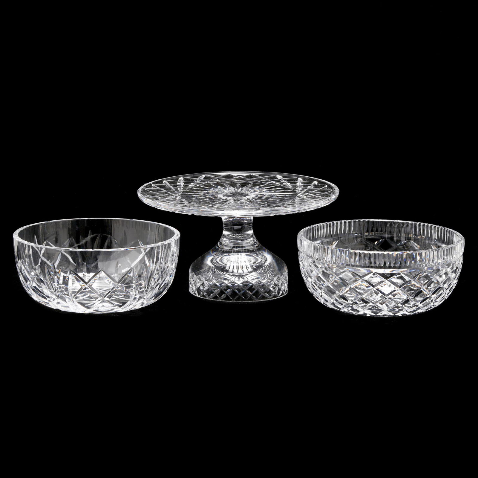 Waterford, Three Cut Crystal Table Accessories: Waterford, Three Cut Crystal Table Accessoriesto include: a "Comeragh (Cut)" cakestand (5 1/4 x 9 7/8in.); (2) "Giftware" round bowls (3 1/2 x 8 in.); all signed to underside. Private collection, Chap