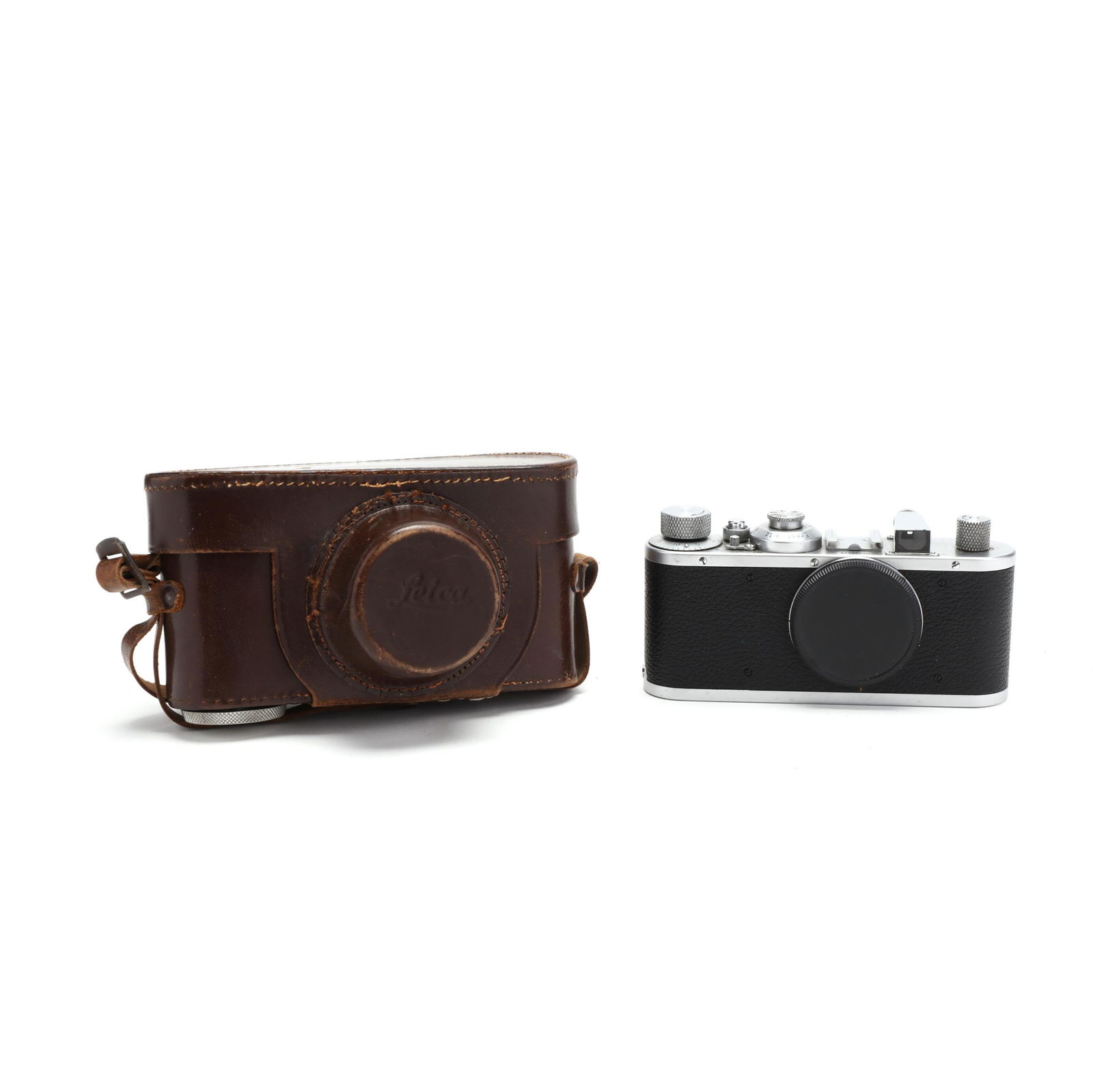 Vintage Leica D.R.P. Leitz Wetzlar Camera Body: Vintage Leica D.R.P. Leitz Wetzlar Camera BodyGermany, No. 322598 (1939), rangefinder camera, without lens; includes leather case with strap. 2-5/8 x 5-3/4 x 1-1/4 in. without case Private Collection