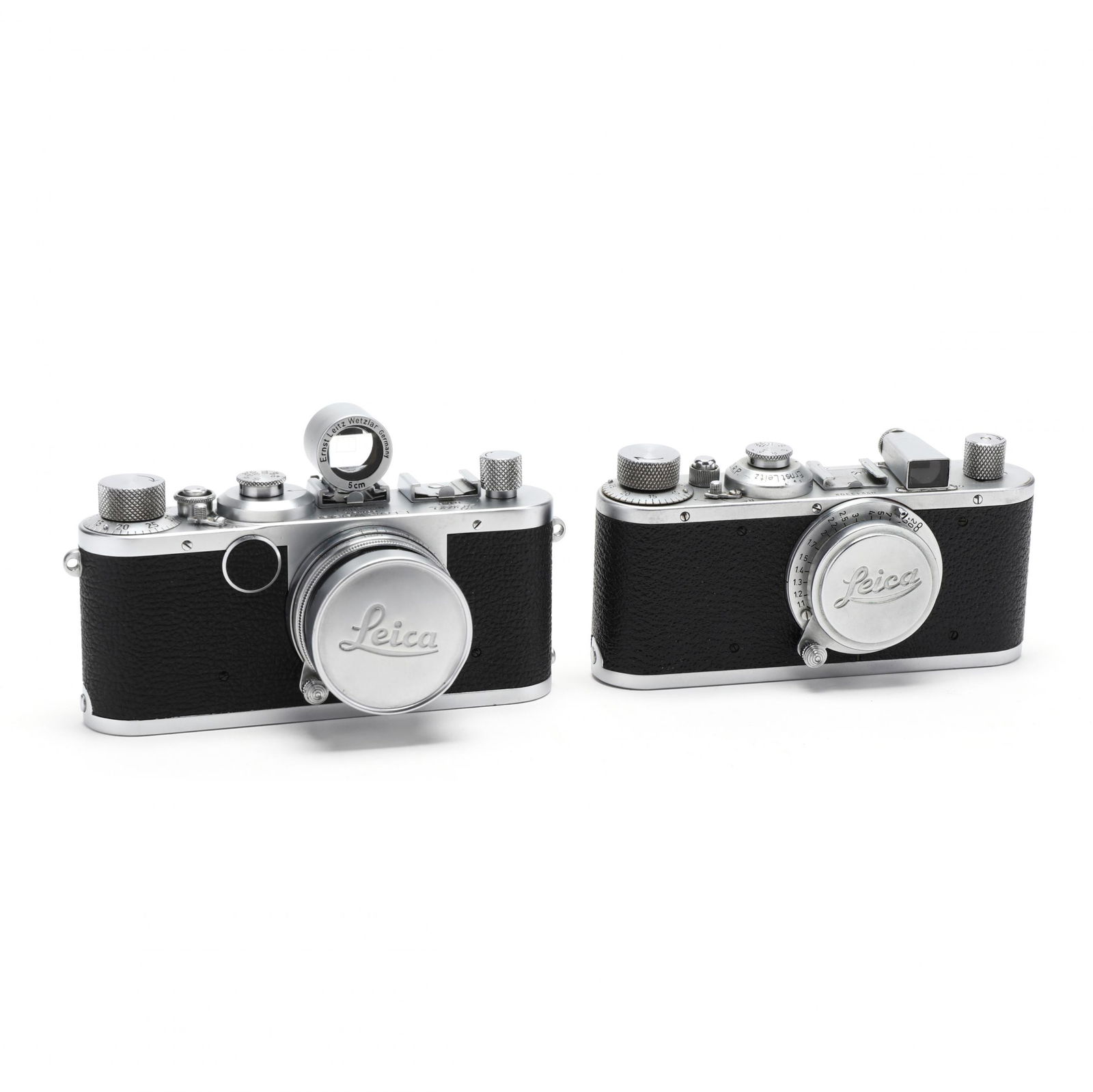 Two Vintage Leica D.R.P. Leitz Wetzlar Rangefinder: Two Vintage Leica D.R.P. Leitz Wetzlar Rangefinder Cameras, Each With LensGermany, No. 213302 (1936) with a Leitz Elmar f=3,5 cm 1:3,5 lens; No. 523671 (1957) with an Ernst Leitz Wetzlar Summicron f =