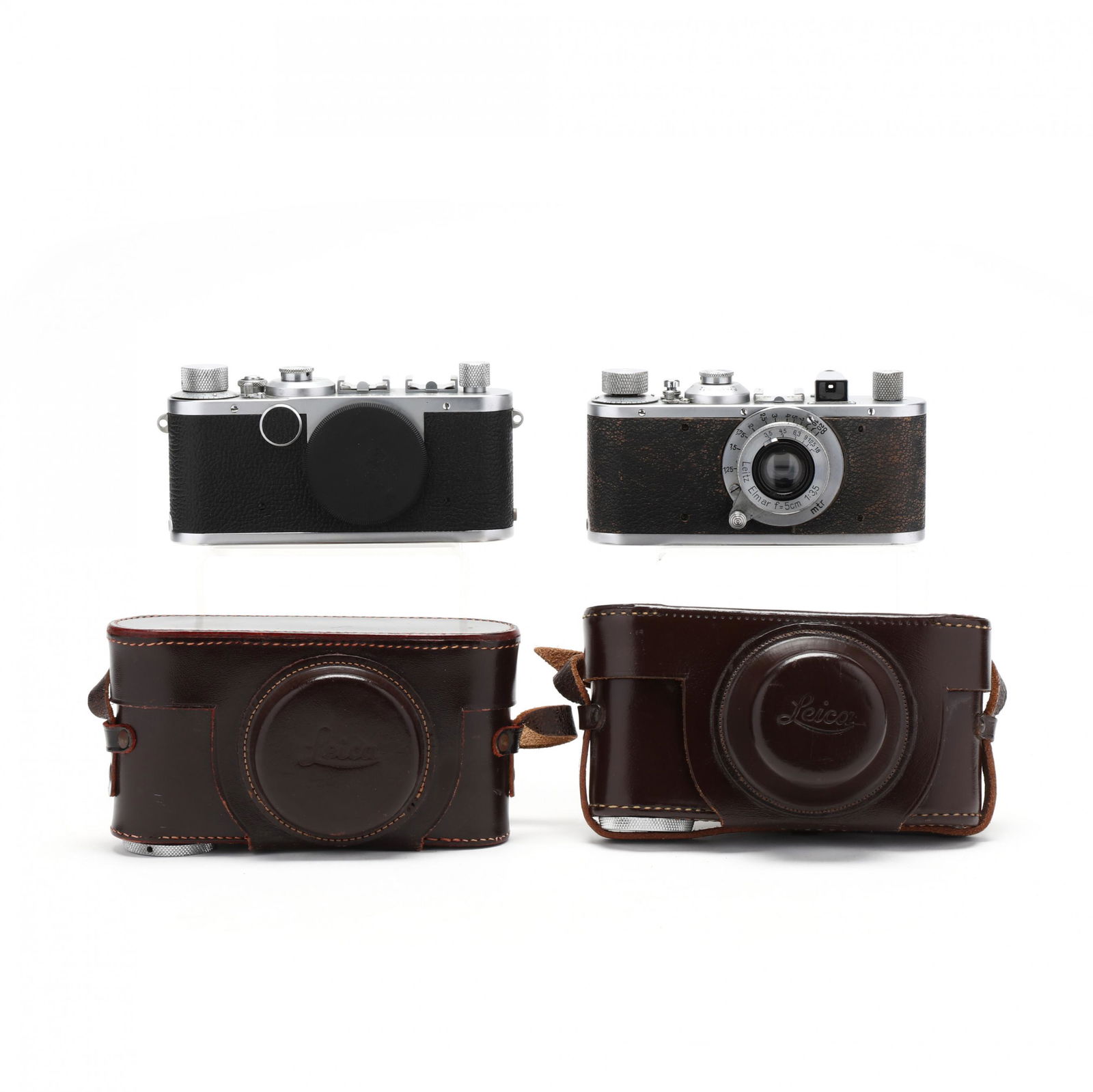 Pair of Vintage Leica D.R.P. Leitz Wetzlar Cameras, One: Pair of Vintage Leica D.R.P. Leitz Wetzlar Cameras, One with LensGermany, No.'s 313472 (1939) and 521941(1950), rangefinder cameras, the early one with Leitz Elmar f=5cm 1:3,5 lens, both cameras inclu