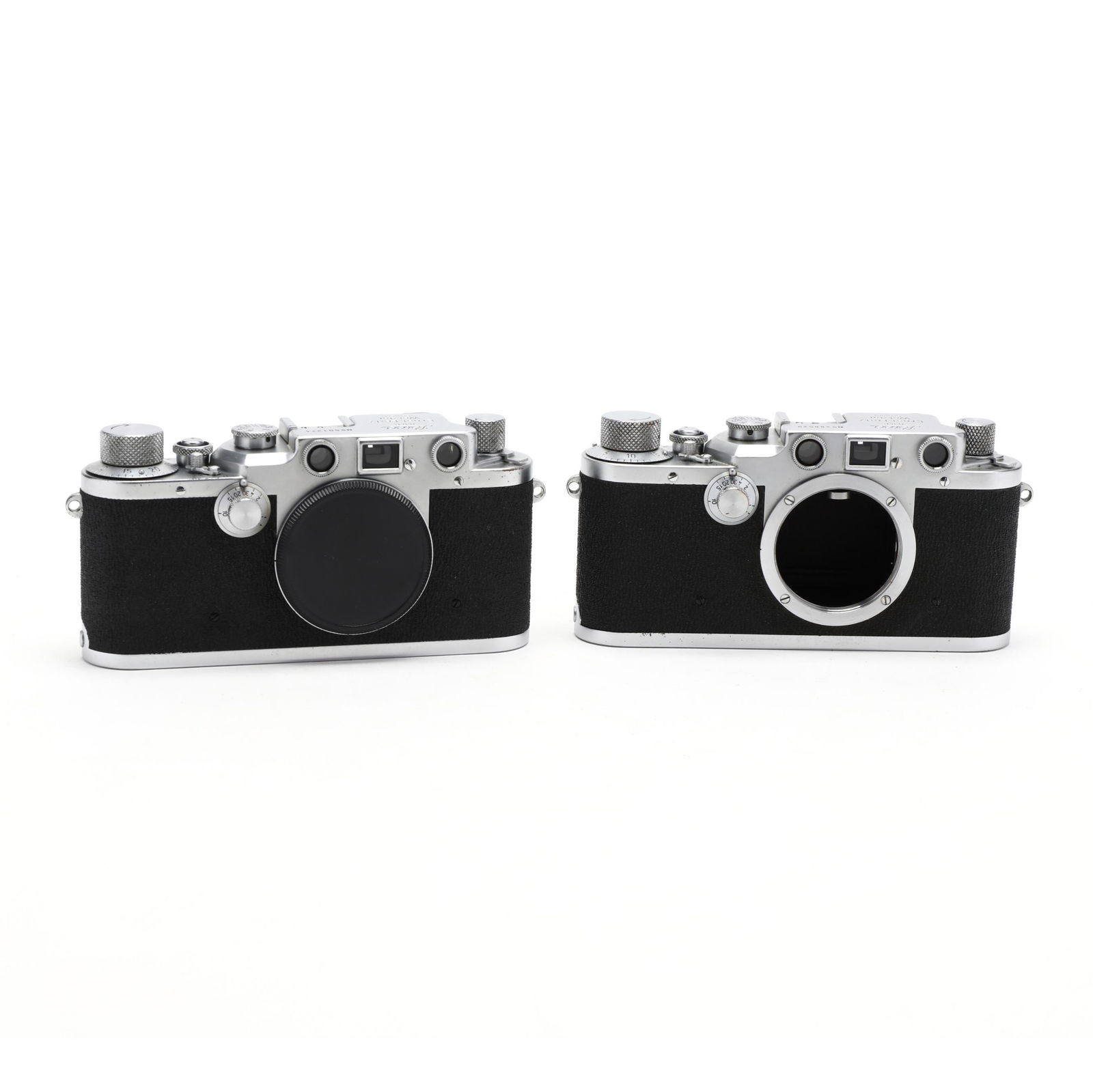 Pair of Vintage Leica D.R.P. Leitz Wetzlar Cameras,: Pair of Vintage Leica D.R.P. Leitz Wetzlar Cameras, Each Without LensGermany, No.'s 488529 (1950) and 501274 (1959), rangefinder cameras, both without a lens. 2-3/4 x 5-3/4 x 1-1/4 in. Private Collect