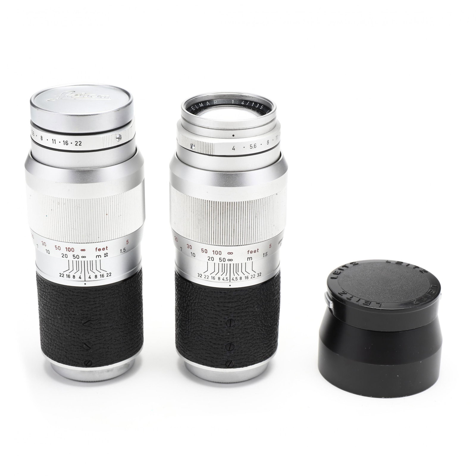 Pair of Vintage Leica 135mm f/4 Lenses: Pair of Vintage Leica 135mm f/4 Lenses Germany, No.'s 17333101 and 1890337, Leitz Wetzlar Elmar 1:4/135 lenses, compatible with Leica M Cameras, with Leica shade and lens cap. 5 1/2 in. (with shade) P