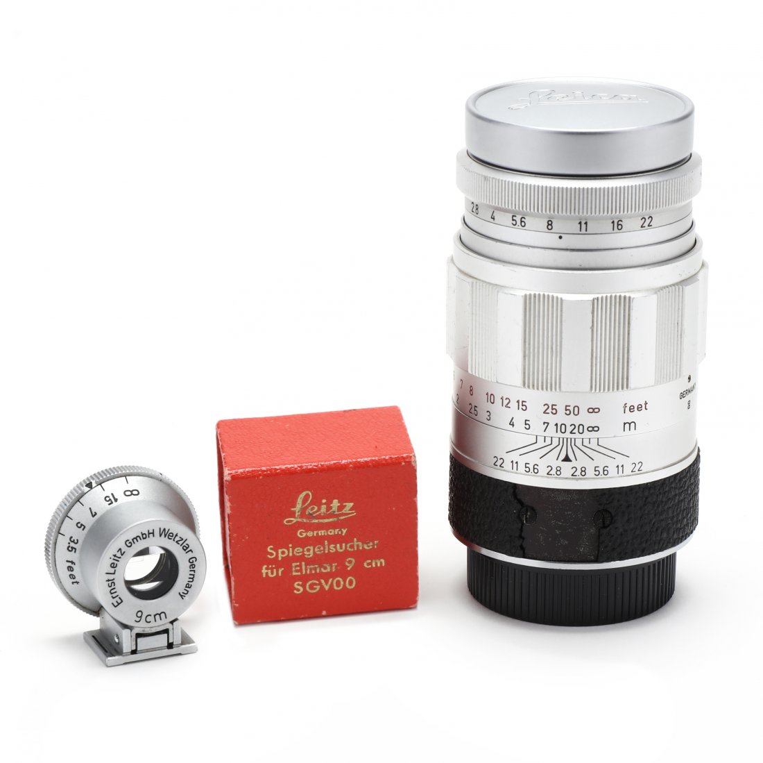 Leica Leitz Wetzlar Elmarit F 2.8 90mm Lens, with 9cm: Leica Leitz Wetzlar Elmarit F 2.8 90mm Lens, with 9cm Viewfinder Germany, Lens No. 1683316, with meter and feet scale, includes Leica lens cap; Ernst Leitz GmbH Wetzlar 9 cm viewfinder, with feet scal