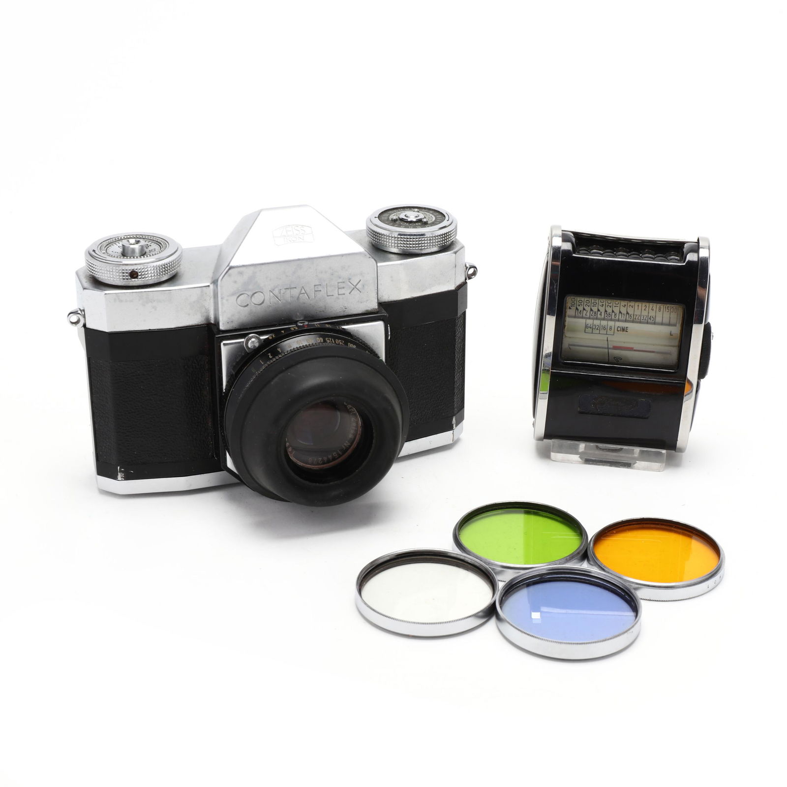 Vintage Carl Zeiss Ikon Contaflex 35mm Film Camera With: Vintage Carl Zeiss Ikon Contaflex 35mm Film Camera With Accessoriesfitted with a Carl Zeiss Tessar 1:2,8 45mm lens and sun shade; kit includes four Walz filters and a light meter (lacking maker's plat