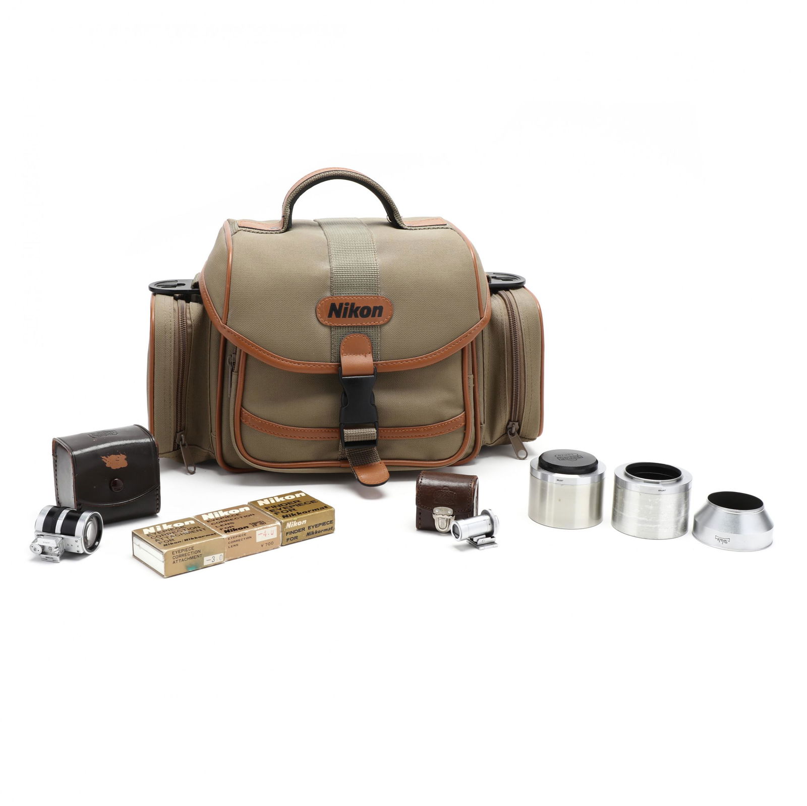 Nikon Camera Bag with Nine Camera Accessories,: Nikon Camera Bag with Nine Camera Accessories, including two Nippon ViewfindersNikon olive camera tote, including the following accessories: Nippon Kogaku Nikon Varifocal Viewfinder, 3.5cm - 13.5cm; N