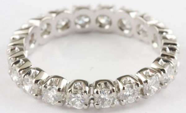 Platinum Diamond Eternity Wedding Band: Platinum Diamond Eternity Wedding Band with a flat shank and (20) prong set brilliant cut diamonds (1.88 ct. total, G color, VS clarity). Professional appraisal available. Estimated replacement value: