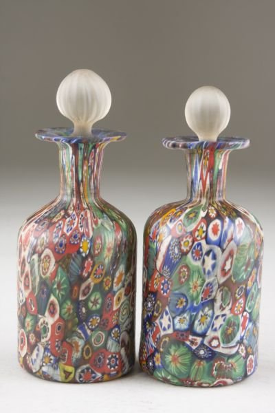 Pair Italian Art Glass Millefiori Perfumes: Pair Italian Art Glass Millefiori Perfumes 19th century, hand blown, colorful millefiori bottles having long necks and ruffled rims with frosted glass stoppers. 5.5 in.