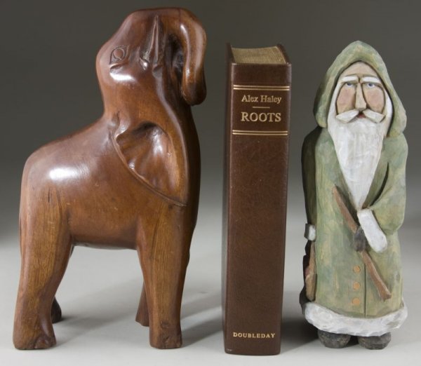 Alex Haley Signed Copy of "Roots" and Two Carvings: Alex Haley Signed Copy of "Roots" and Two Carvings the book numbered "65" of a 500-copy limited edition, (Garden City, New York: Doubleday, 1976), 587 pp., 8vo, brown leatherette covers with slipcase.