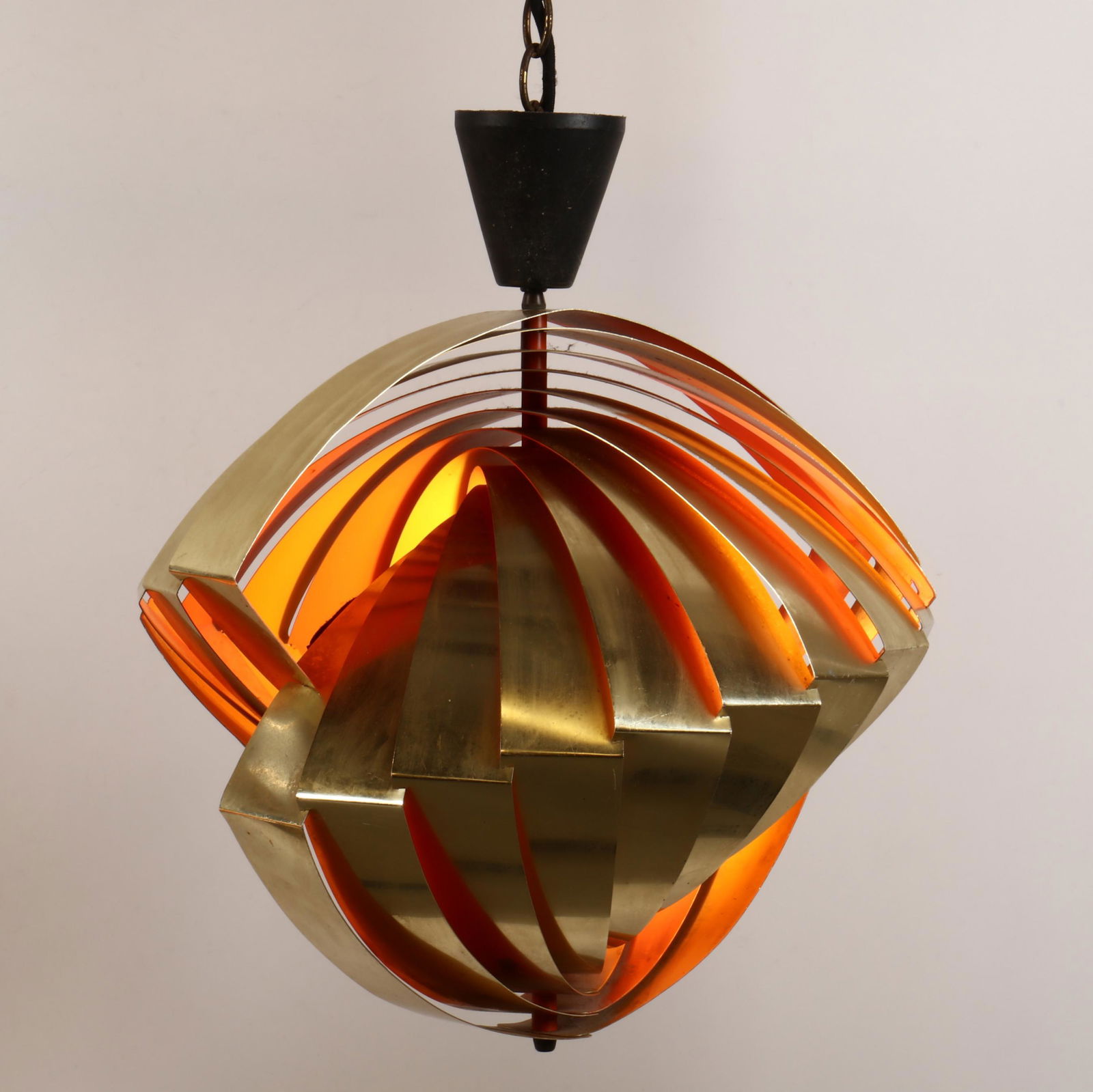 Louis Weisdorf (Denmark, 1932-2021), Konkylie Hanging: Louis Weisdorf (Denmark, 1932-2021), Konkylie Hanging Light for LyfaDenmark, 1970s, brass with two tone orange and yellow interior, unmarked, with black cloth cord and ceiling cap having later brass c