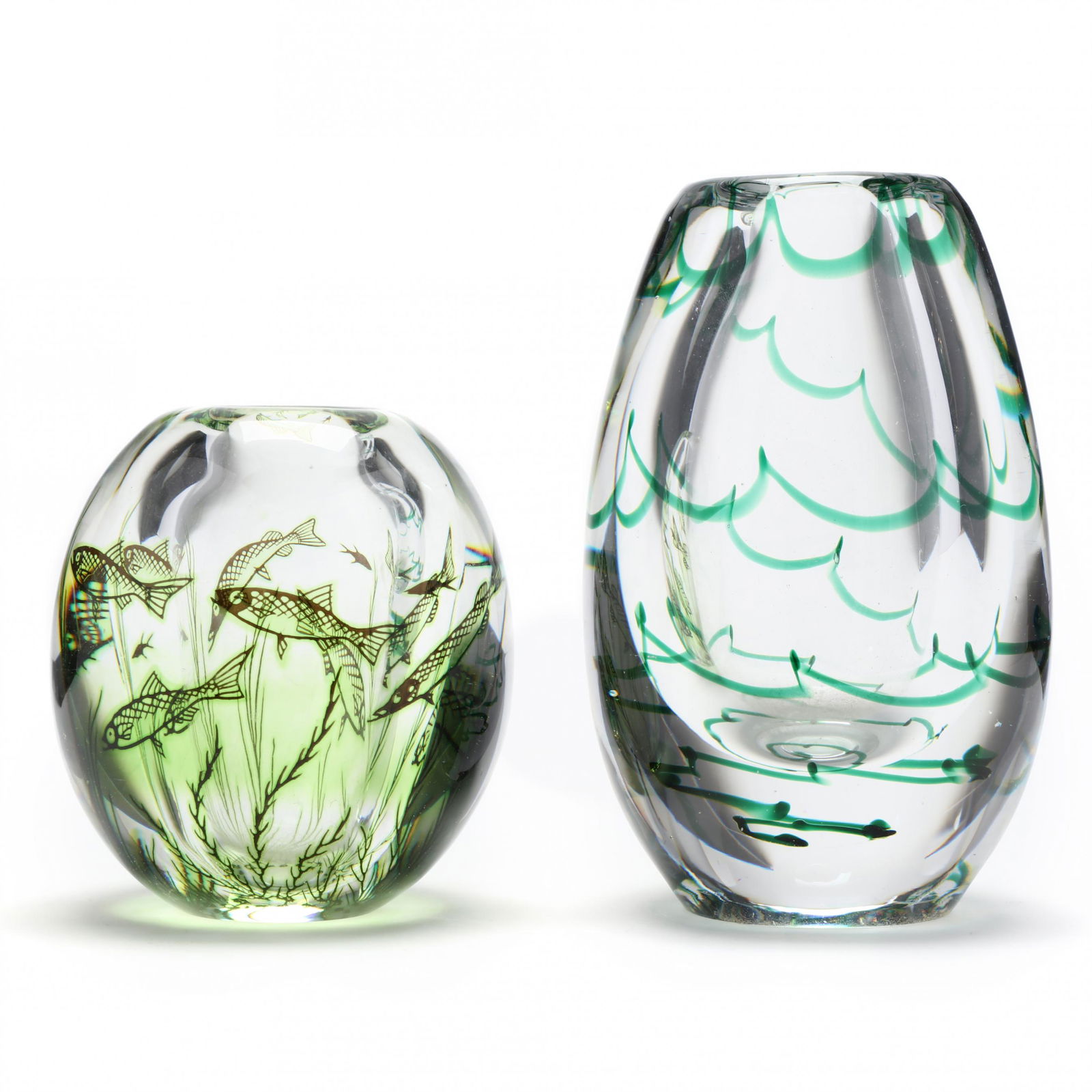 Two Mid Century Swedish Art Glass Vases: Two Mid Century Swedish Art Glass Vasesincluding a thick cased glass vase with fish decoration by Edward Hald for Orrefors (5.25 in.), and a thick clear vase with cased green spiral wave design by Eli