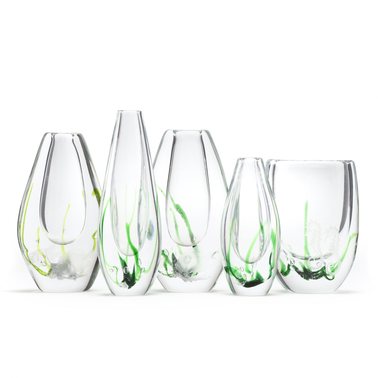 Vicke Lindstrand (Swedish, 1904-1983), Five Seaweed: Vicke Lindstrand (Swedish, 1904-1983), Five Seaweed Glass Vases for Kostathick blown glass with with cased green and airtrap designs, including one with engraved seahorses, two with engraved fish, and