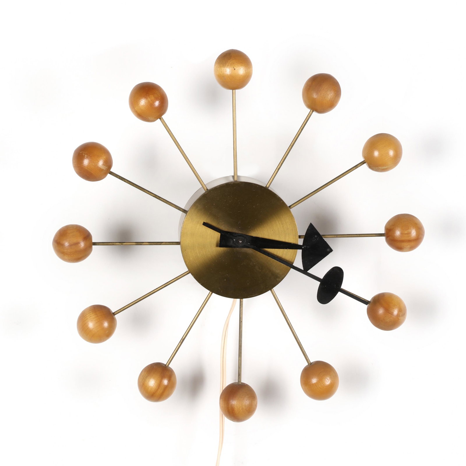 George Nelson (American, 1908-1986), Mid Century Wall: George Nelson (American, 1908-1986), Mid Century Wall Clock 1960s, brushed brass with maple balls, black and red painted metal hands, appears unmarked. 14 in. diameter Private Collection of a Lady, Du