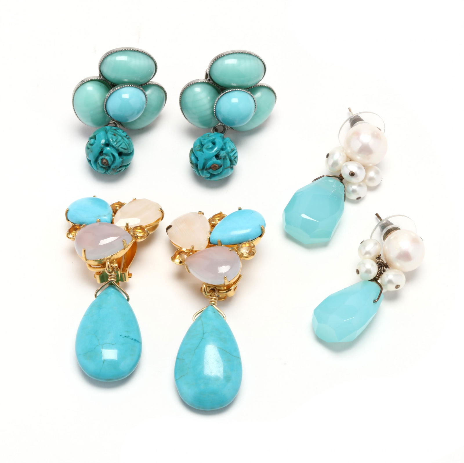 Three Pairs of Fashion Earrings: Three Pairs of Fashion Earringsto include: a pair of dangle earrings by Philippe Ferrandis in a flower motif with blue glass cabochons suspending a carved bead drop, completed with clip backs, stamped
