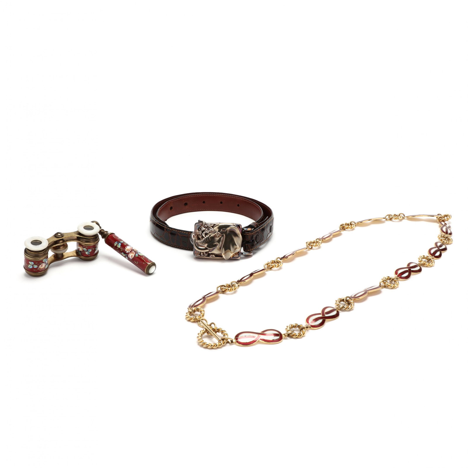 Three Fashion Items: Three Fashion Items A Kieselstien-cord alligator belt with a double sided elephant theme buckle, dated 1998, sign(27 in. to first aperture) (wear around first aperture); an enamel and rope circlet lin