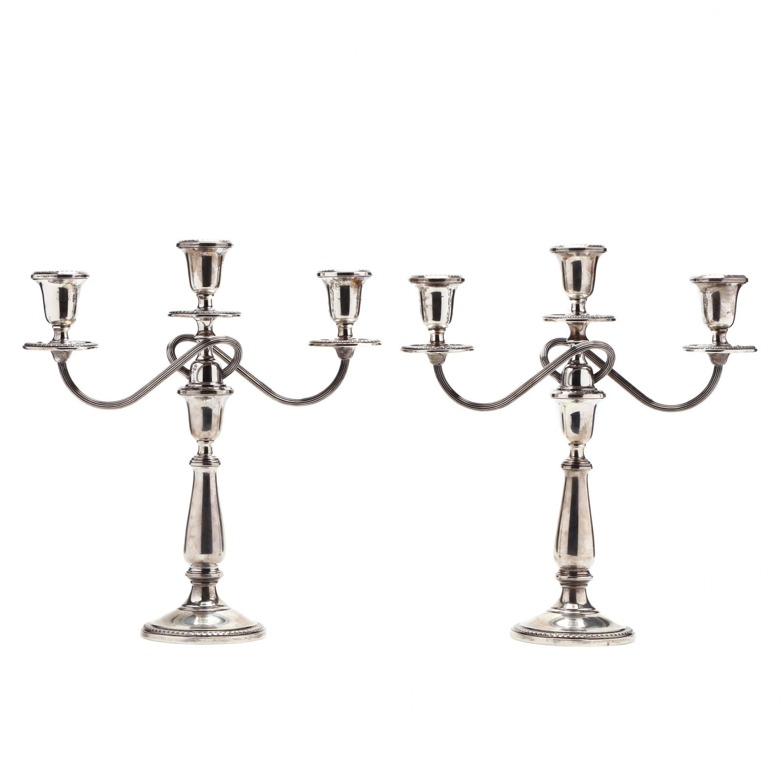 A Pair of Sterling Silver Candelabra by Towle: A Pair of Sterling Silver Candelabra by Towle model number 74, no monograms, convertible three-light form. 14 1/8 in. Private collection, Hillsborough, North Carolina Additional high-resolution photos