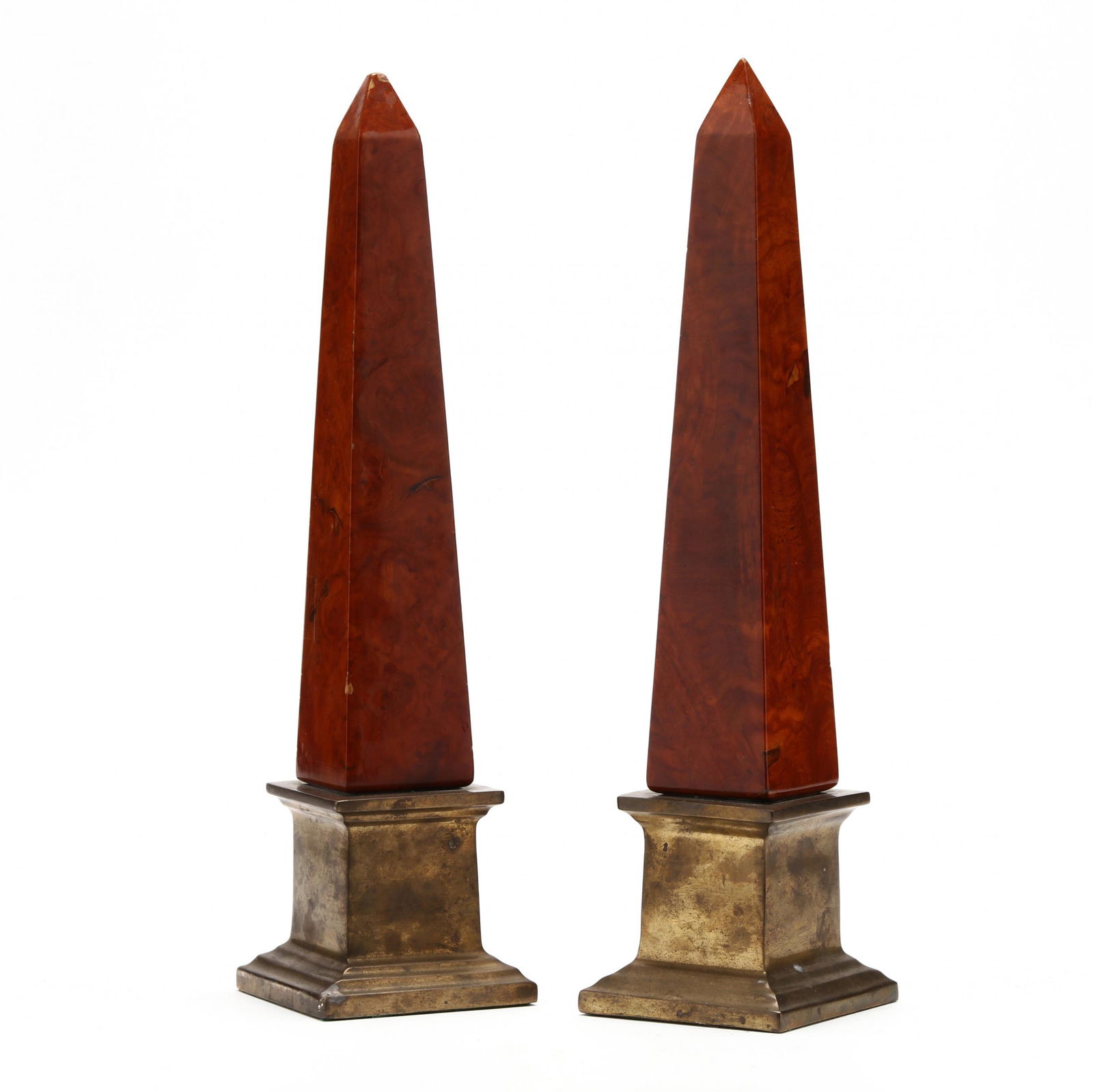 Pair of Mahogany and Brass Obelisks: Pair of Mahogany and Brass Obelisks20th century, unmarked, obelisk shaft in deep sienna polished mahogany veneers, mounted atop a brass plinth. HOA 15 1/4 in. Additional high-resolution photos are av