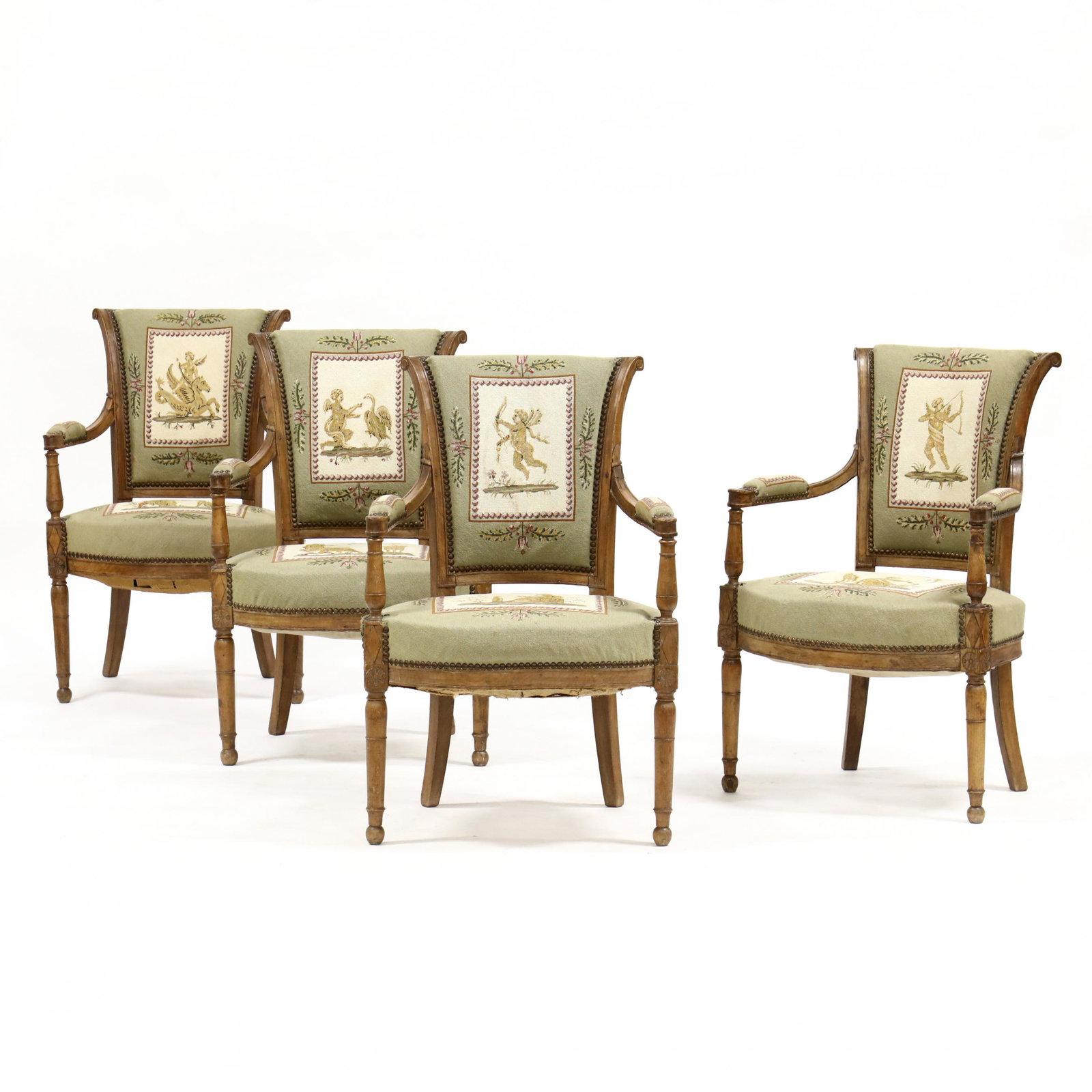Set of Four Directoire Carved Fruit Wood Fauteuil: Set of Four Directoire Carved Fruit Wood Fauteuil early 19th century, molded and scrolled crest rail, paneled stiles, rosette carved arm terminus, ring turned arm supports, over upholstered needlepoin
