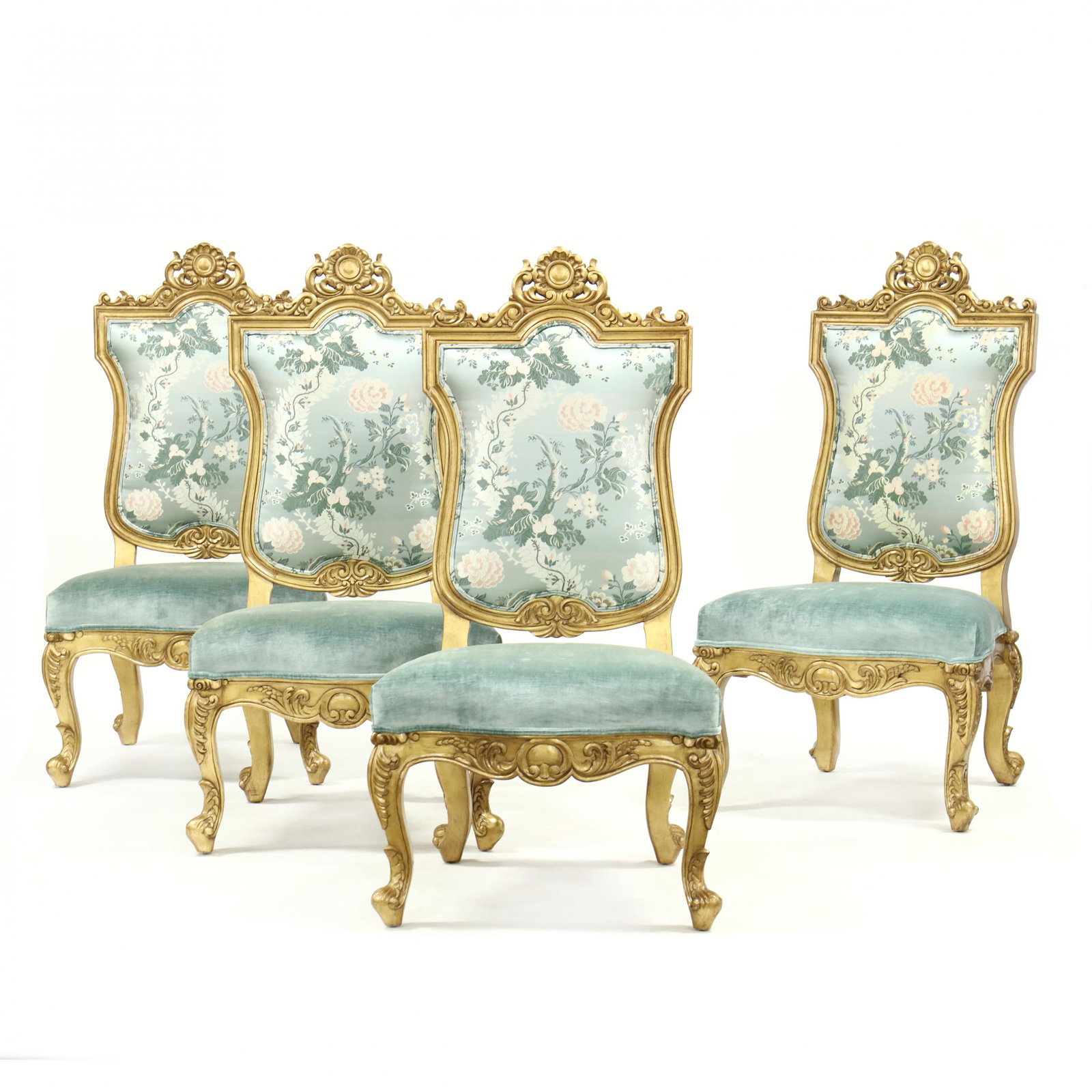 Set of Four Italianate Carved and Gilt Oversized Side: Set of Four Italianate Carved and Gilt Oversized Side Chairs contemporary, carved and gilt wood frames with embroidered floral shaped backs, plush light blue upholstered serpentine seats on carved cab