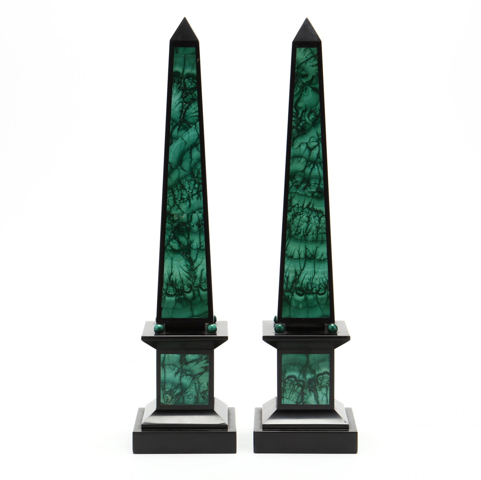 Pair of Malachite and Slate Obelisks: Pair of Malachite and Slate Obelisks20th century, the slate obelisks in malachite veneered panels, mounted atop four ball feet and rectangular plinth, unmarked. 16 x 3 3/4 x 3 3/4 in. Additional high