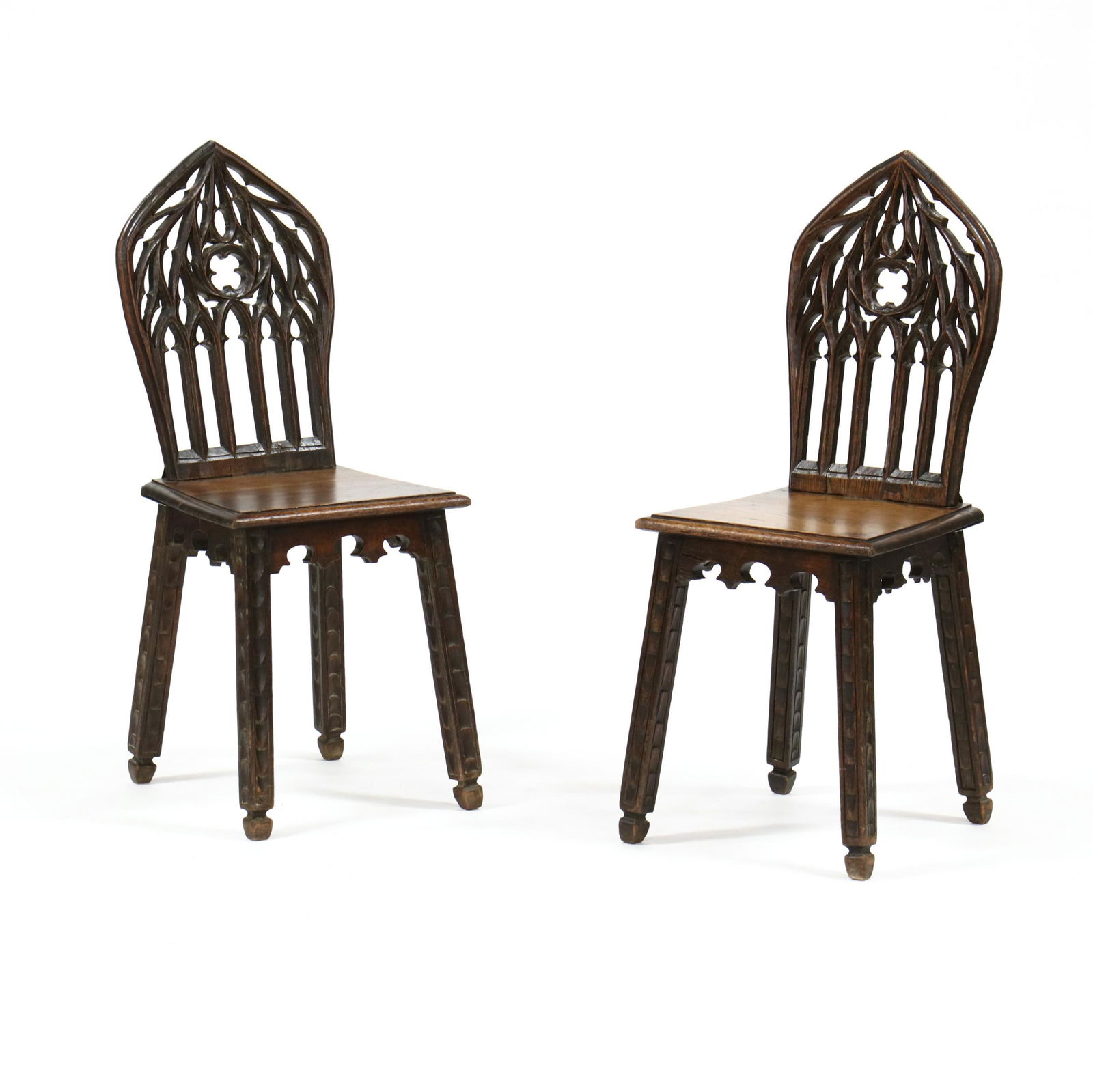 Pair of Gothic Revival Carved Oak Plank Seat Chairs (1 of 4)