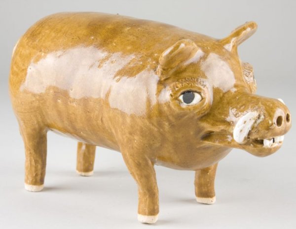 Reggie Meaders Georgia Pottery Boar: Reggie Meaders Georgia Pottery Boar light olive alkaline glaze, the boar has unpainted eyes, large tusks, and is signed on the bottom by the potter. 6.75 x 12 in.
