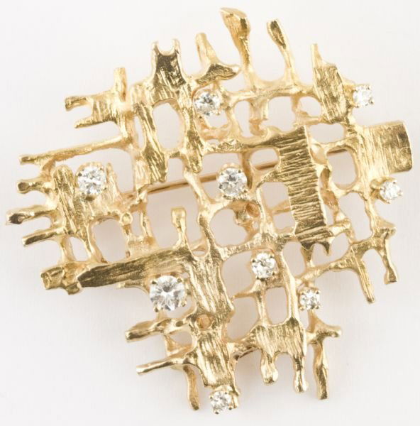 14KT Diamond Grima-Style Brooch: 14KT Diamond Grima-Style Brooch unmarked, but tests as 14KT, with (9) round brilliant cut diamonds (.50 ct., G color, VS clarity). 1 5/8 x 1.5 in.